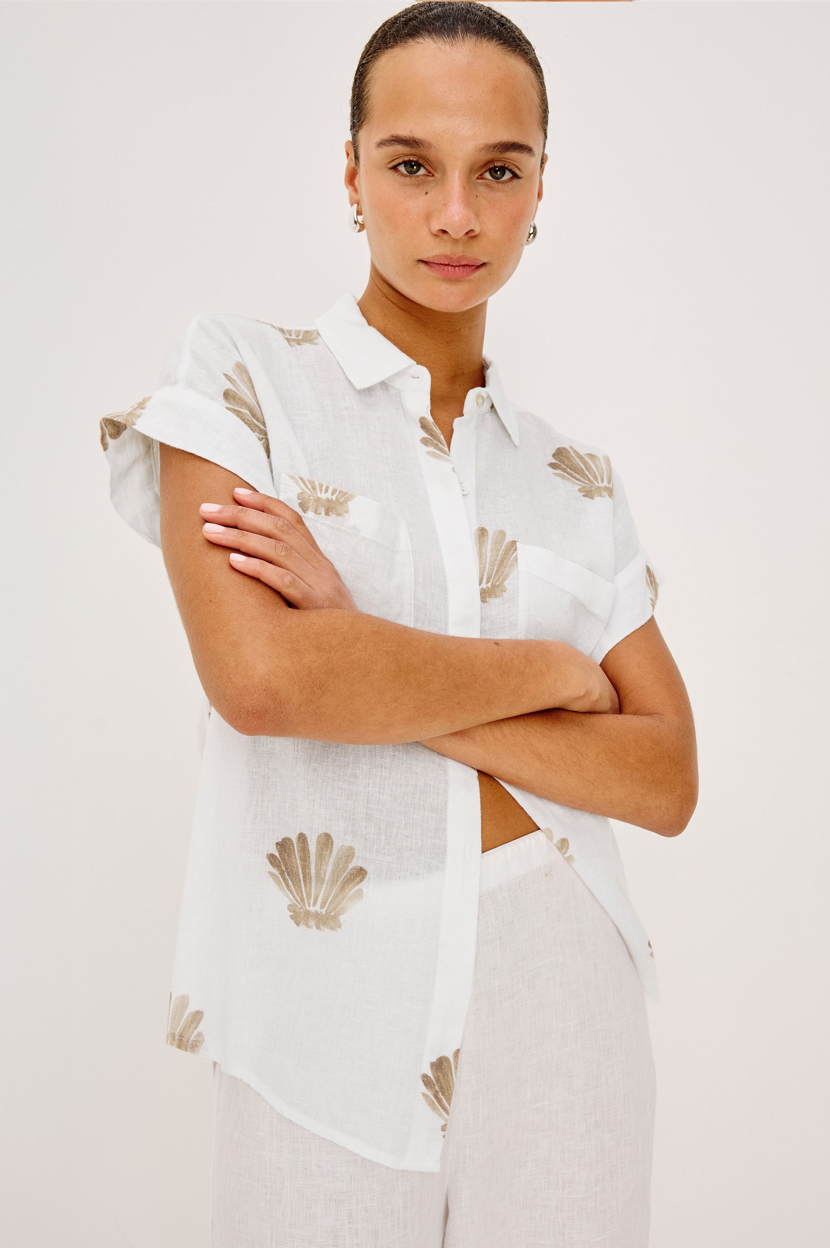 Cito Relaxed Button-Up Shirt in Linen With Collar, Chest Patch Pockets, and Cuffed Cap Sleeves in Taupe Seashells Colorway - Upper Body Front View Featured on Model