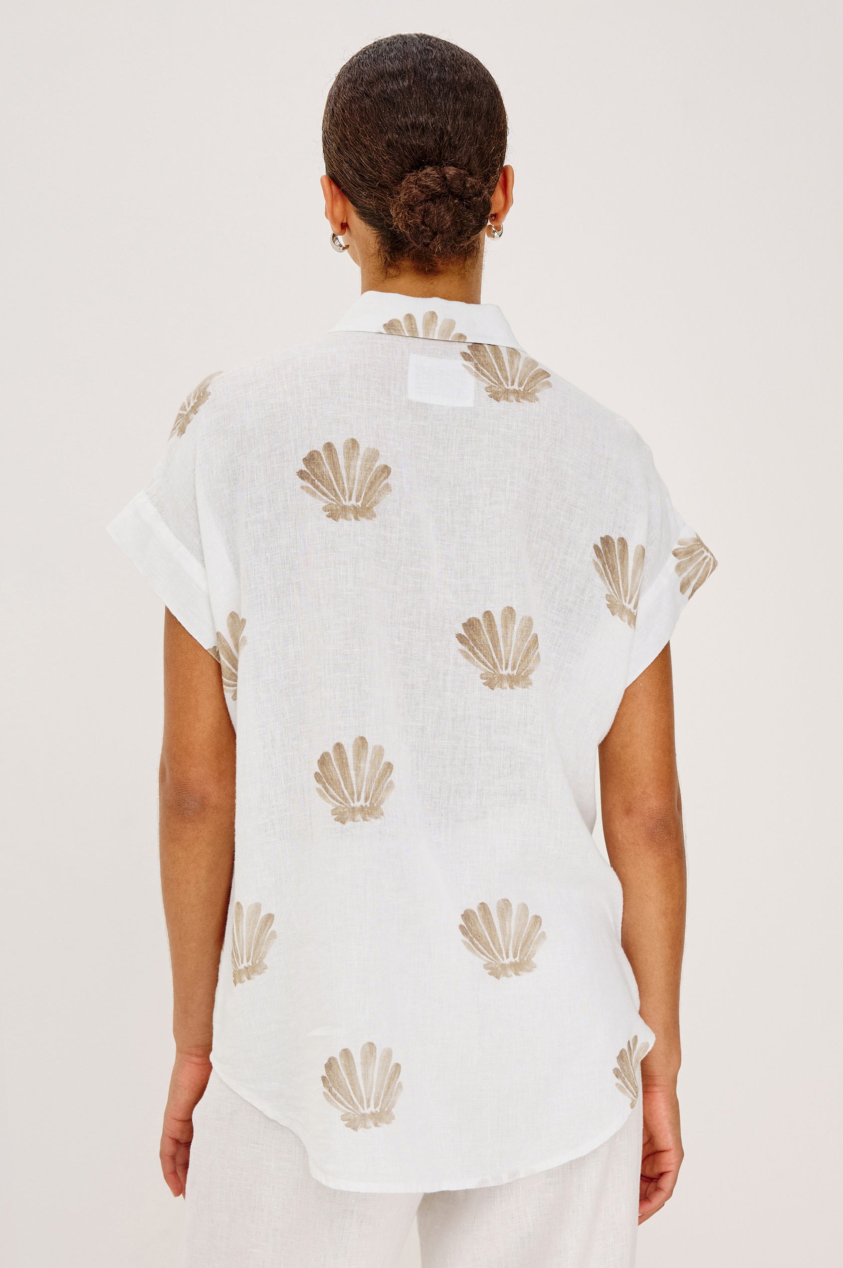 Cito Relaxed Button-Up Shirt in Linen With Collar, Chest Patch Pockets, and Cuffed Cap Sleeves in Taupe Seashells Colorway - Upper Body Back View Featured on Model
