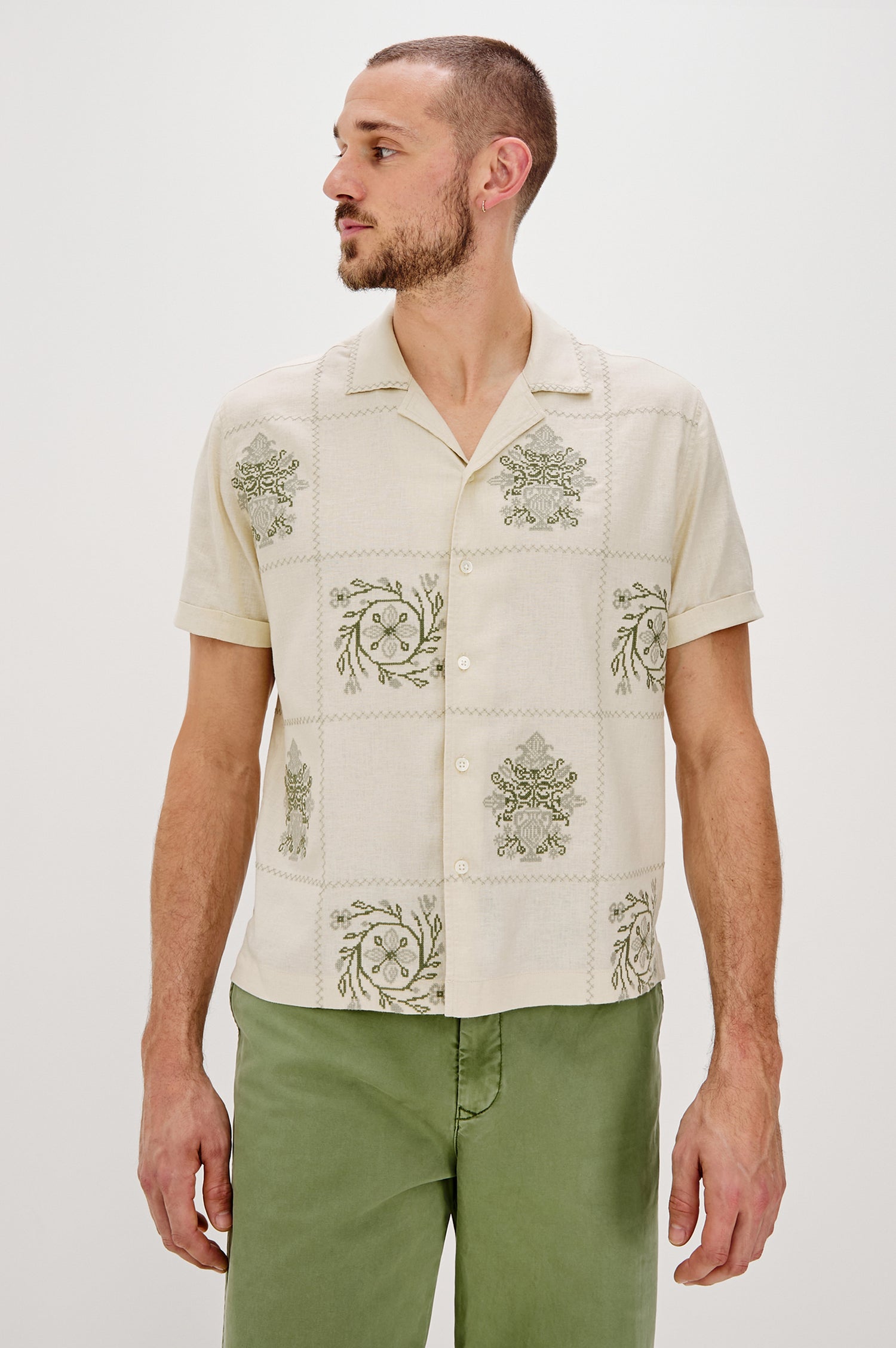 Clairo Button Front Shirt with a Relaxed Lapel, Cuffed Short Sleeves and Embroidery throughout in Cream Quilt Squares Colorway. Front View Shown on Model.