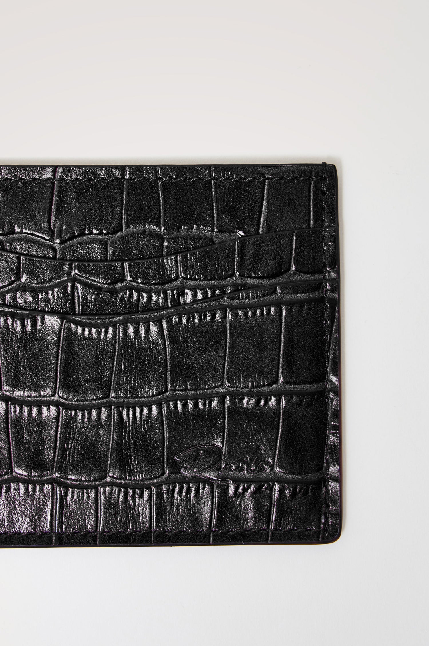 Classic Card Holder in Croc-Embossed Spanish Leather With Top Pocket, Two Front Slip Pockets, and Embossed Rails Logo in Black Croc Embossed Colorway - front close-up view
