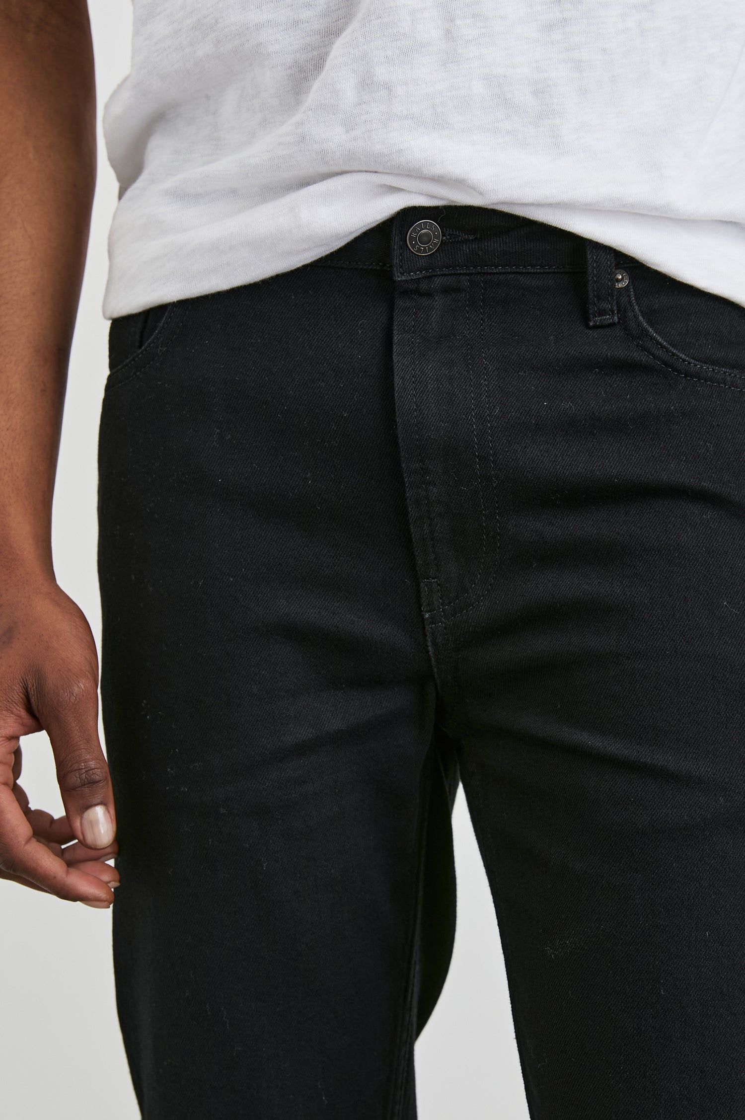 Clayton Slim Straight Jeans with Belt Loops, Two Front Pockets plus a Coin Pocket and Two Back Patch Pockets in Dark Black Colorway - Front View Featured on Model