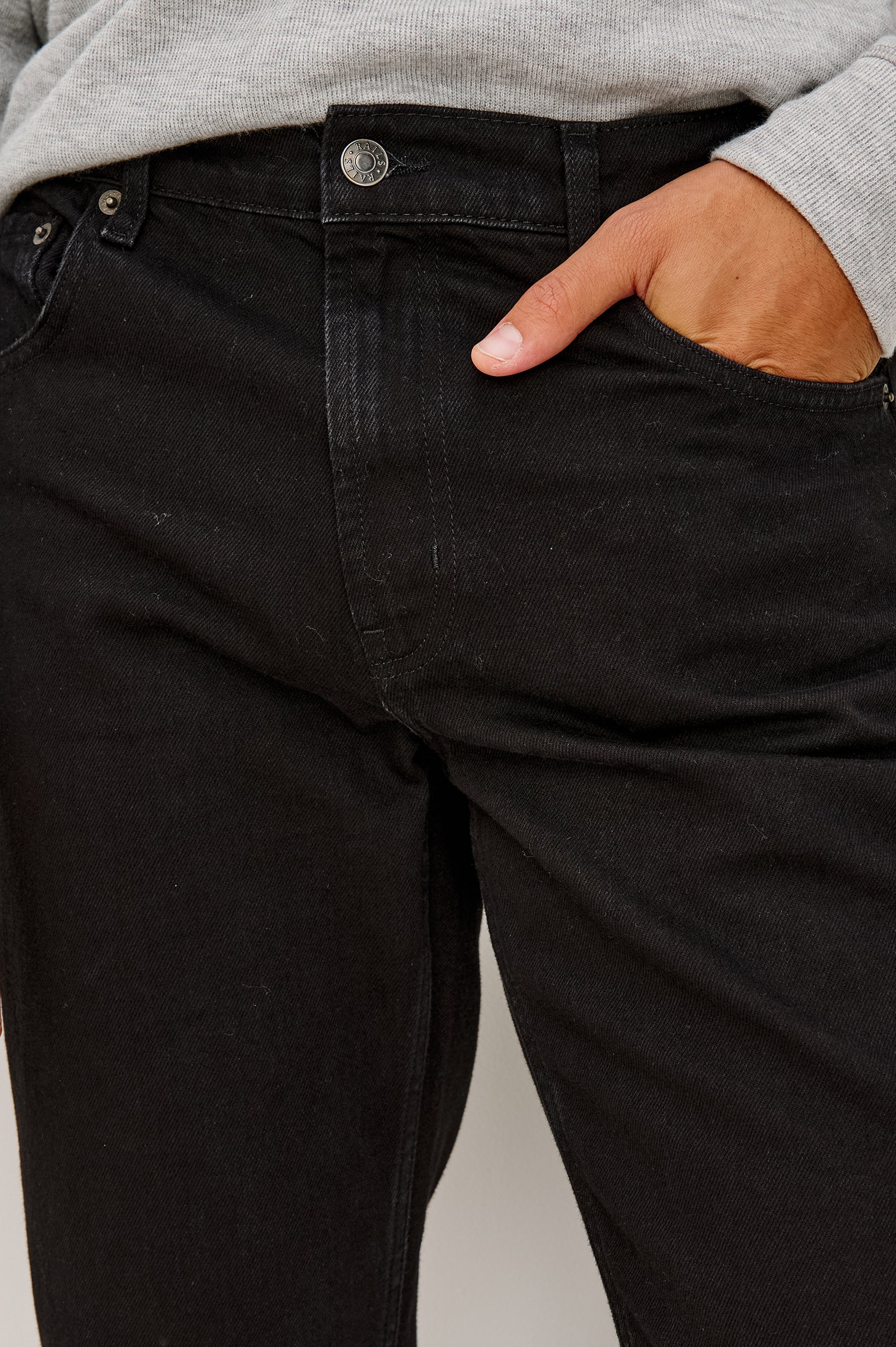 Clayton Slim Straight Jean With 5-Pocket Styling, Belt Loops, and Front Zip-Fly in Dark Black Colorway - Lower Body Front View Featured on Model