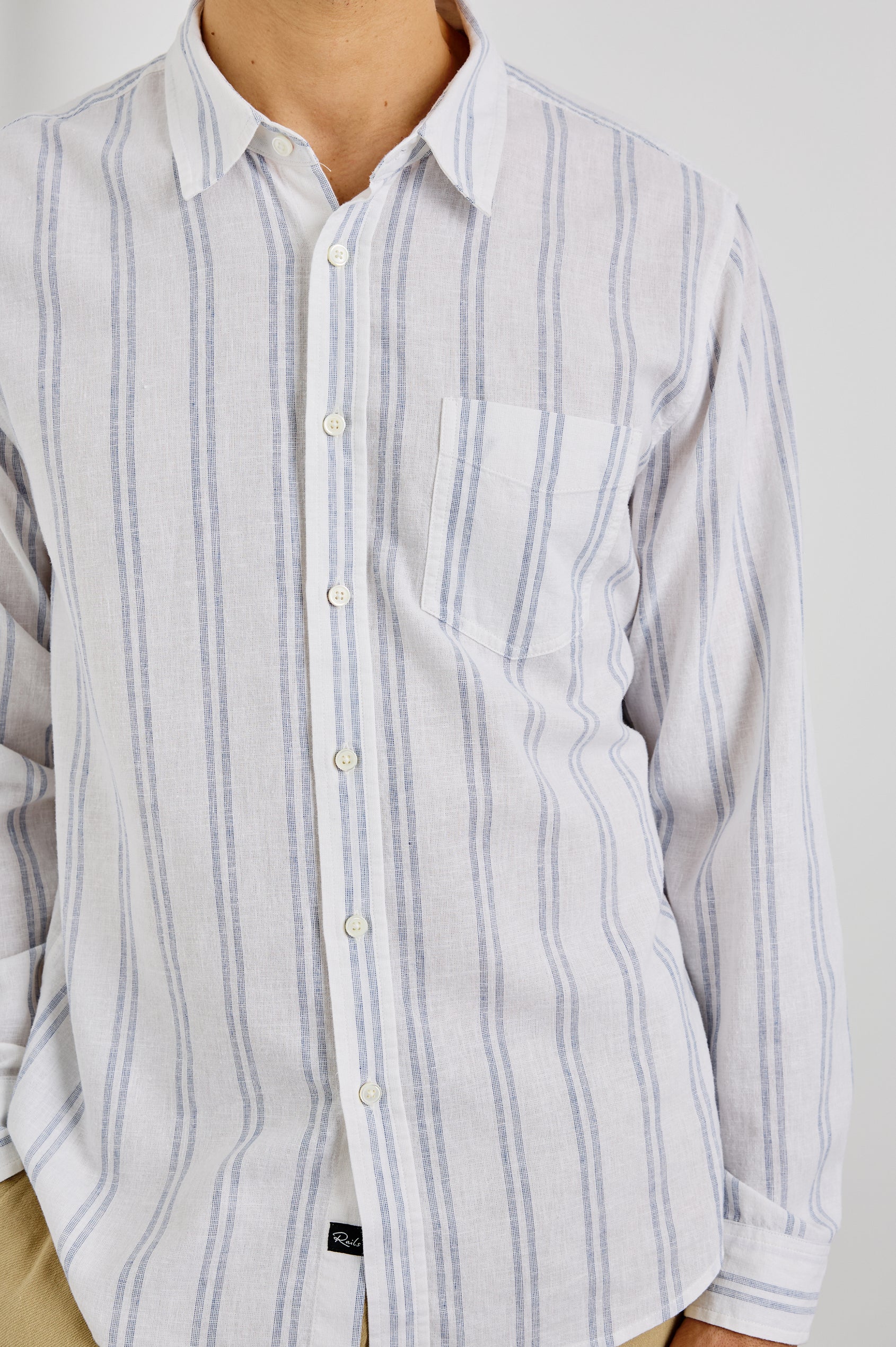 Clyde Collared Button Front Shirt with Long Sleeves and a Chest Pocket in White Azure Colorway. Front View Shown on Model.
