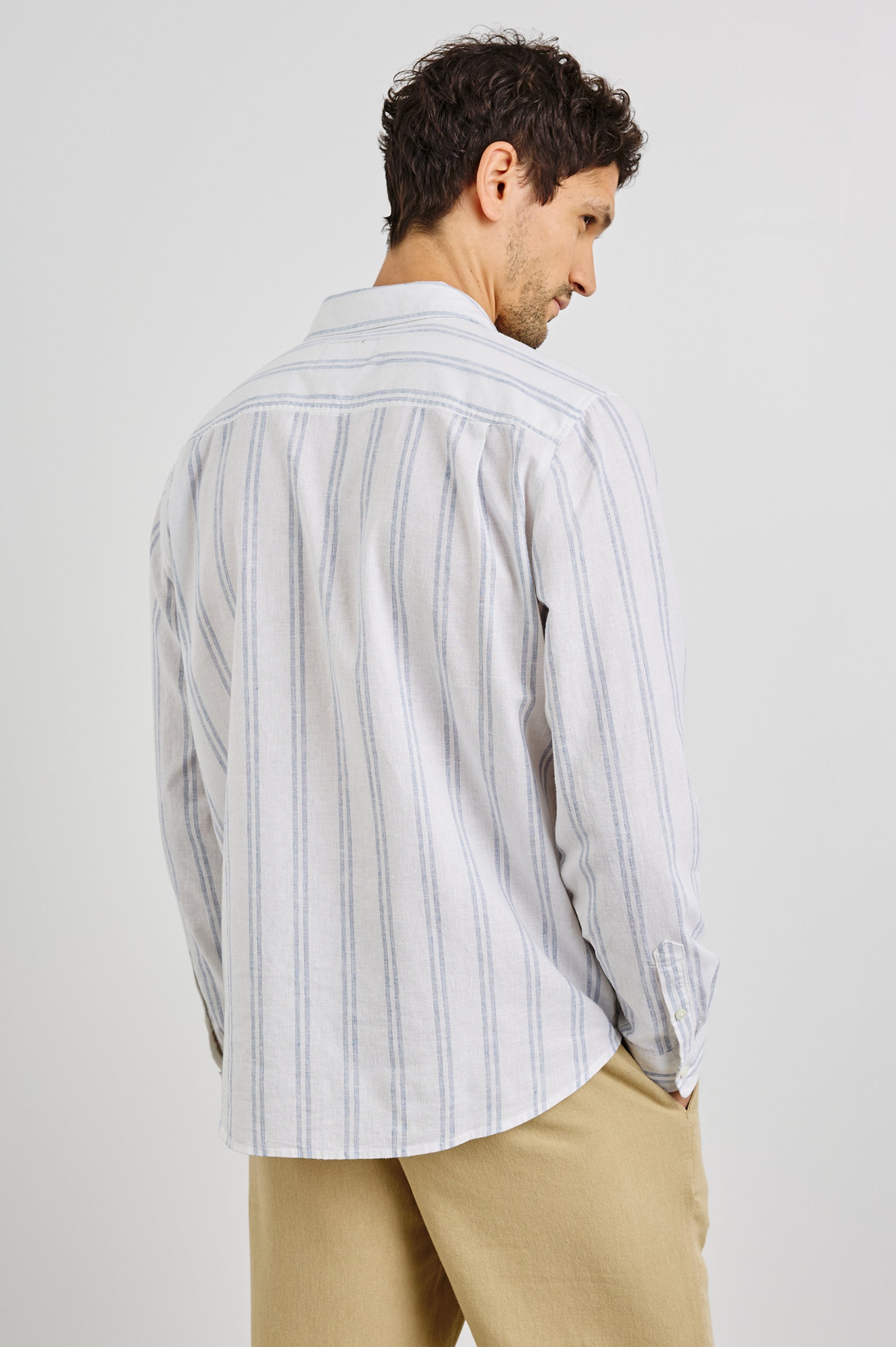 Clyde Collared Button Front Shirt with Long Sleeves and a Chest Pocket in White Azure Colorway. Back View Shown on Model.