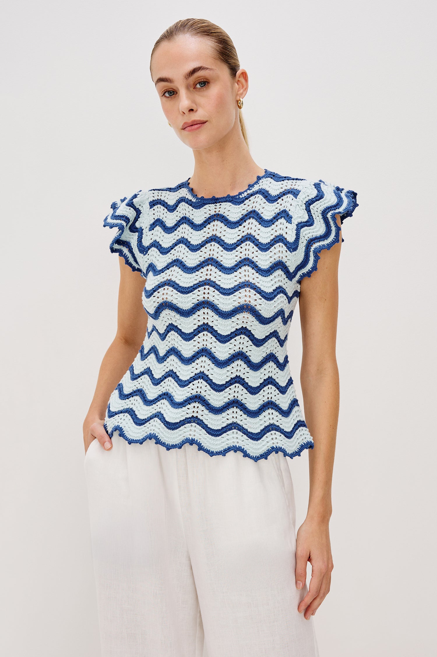 Coen Crew Neck Sweater Top with Short Flutter sleeves, Scalloped Hems in Azure Scallop Colorway. Front View Shown on Model.