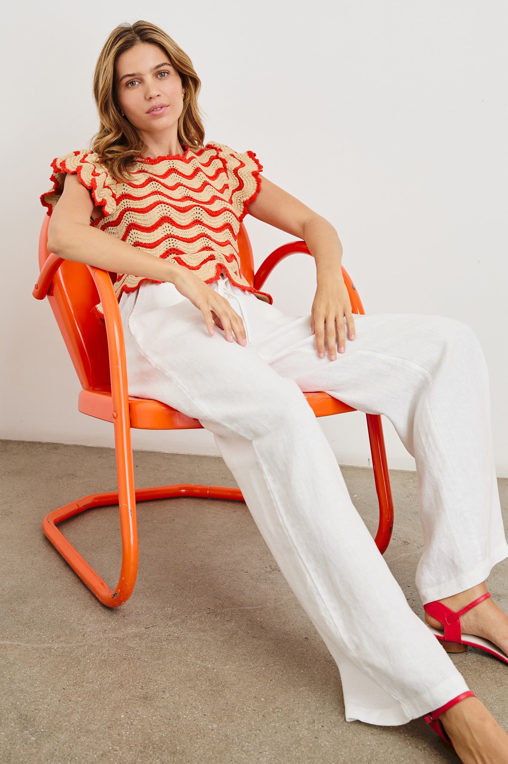 Coen Crochet Knit Short-Sleeve Top with Flared Sleeves and a Back Keyhole Tie in Cherry Oat Stripe Colorway, Horizontal Wavy Stripes - Front Full Body View Featured on Model