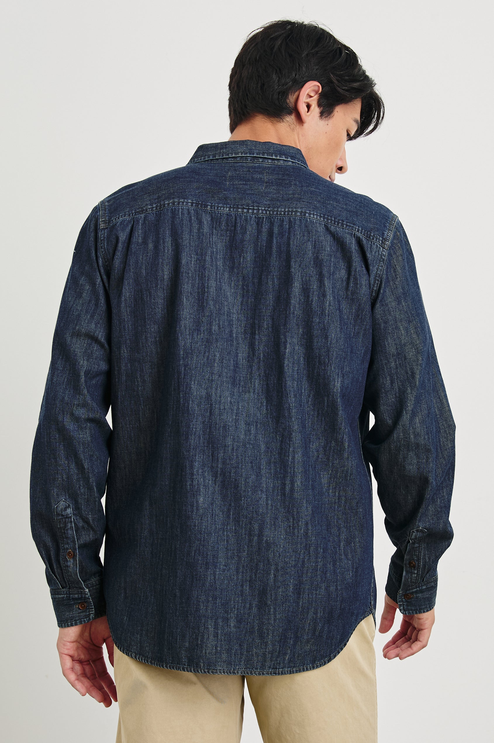 Colton Long-Sleeve Denim Button Up with a Chest Patch Pocket in Dark Wash Indigo Colorway - Back View Featured on Model 
