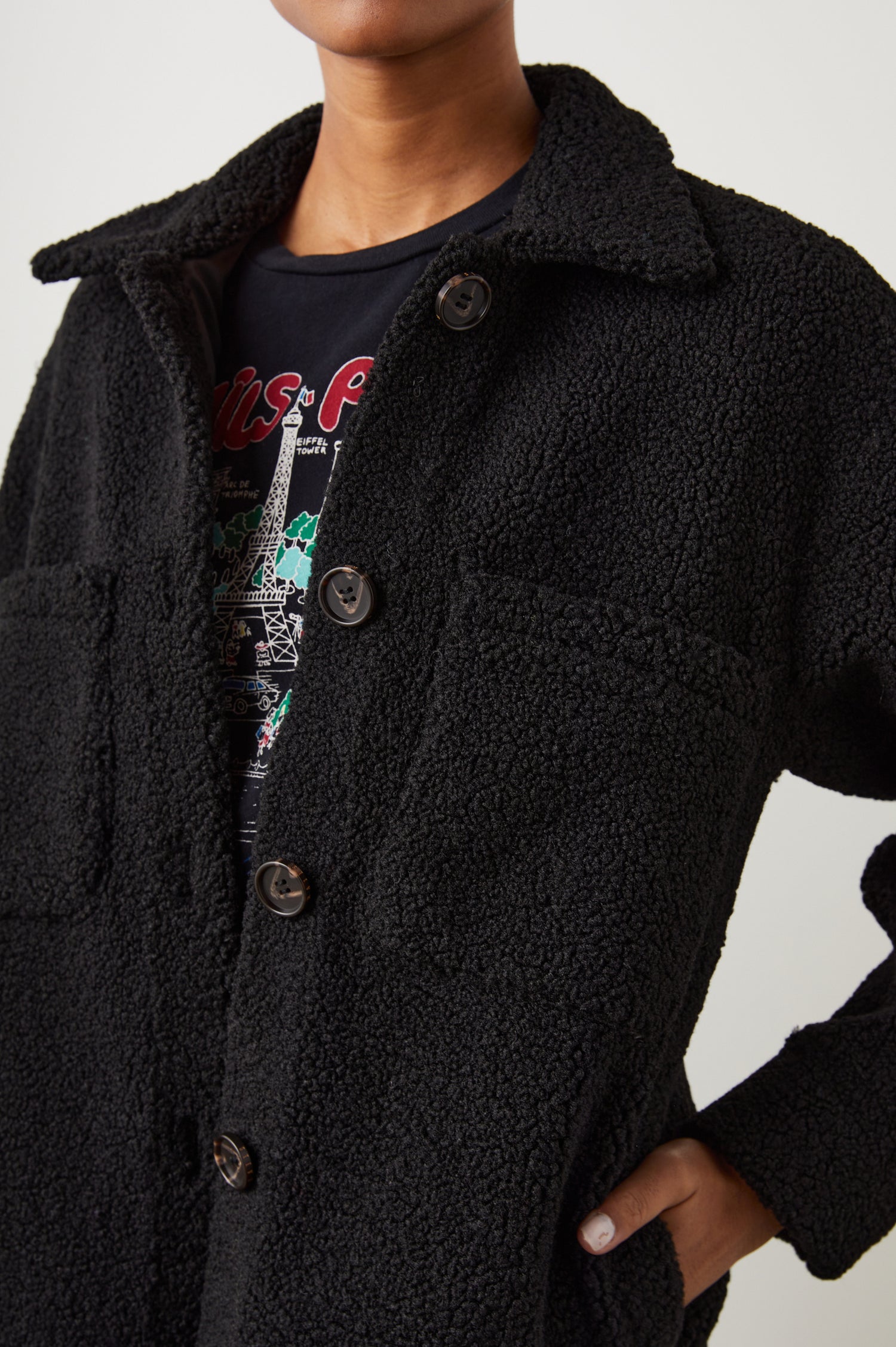 Connie Fleece Shirt Jacket with Button Closure, Two Front Pockets and Two Chest Patch Pockets in Black Teddy Colorway - Front View Featured on Model 