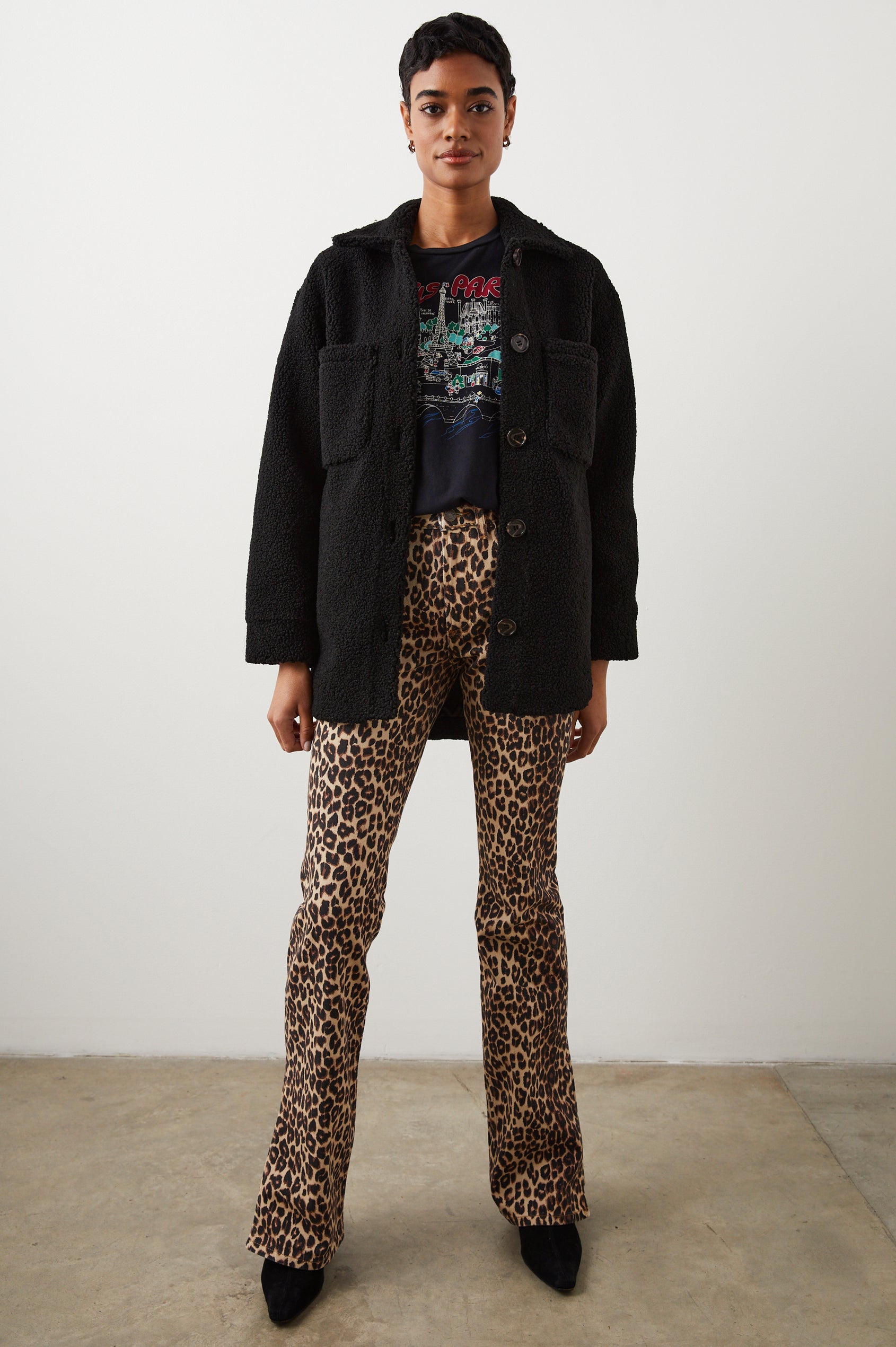 Connie Fleece Shirt Jacket with Button Closure, Two Front Pockets and Two Chest Patch Pockets in Black Teddy Colorway - Front Full Body View Featured on Model 