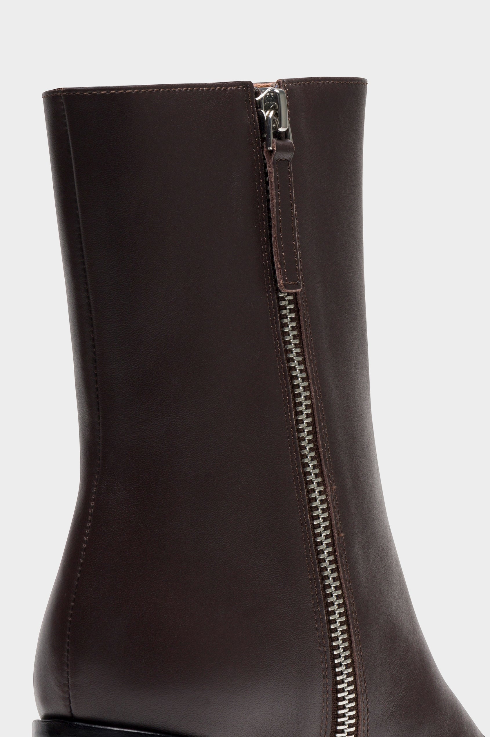 Contour mid length square toe boot with a block heel and side zipper in dark brown Espresso colorway - close up of side zipper