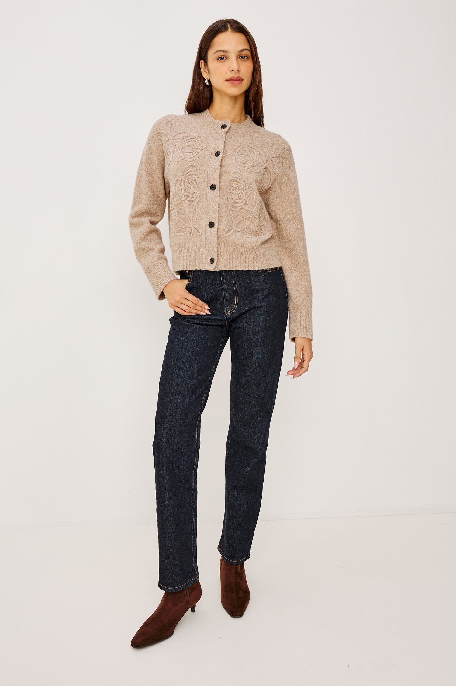Coralee Cardigan in Alpaca Knit With Soutache Rosette Front Detailing, a Crew Neckline, Front Buttons, Ribbed Trim, and Long Sleeves in Sand Colorway - Full Body Front View Featured on Model