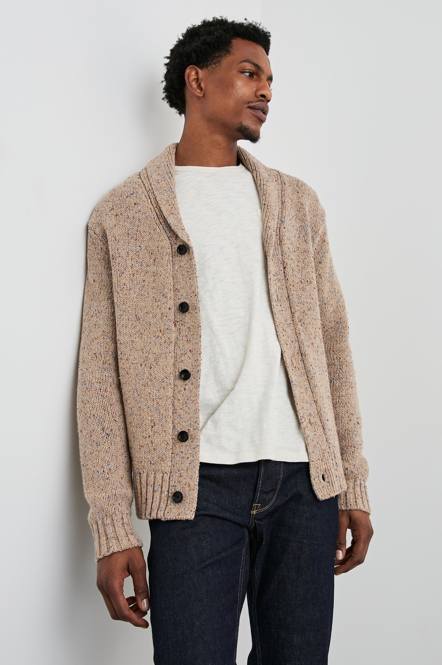 Corden Long-Sleeve Cardigan with Button Closure, a Shawl Collar and Ribbed Trim in Oatmeal Speckle Colorway - Front View Featured on Model