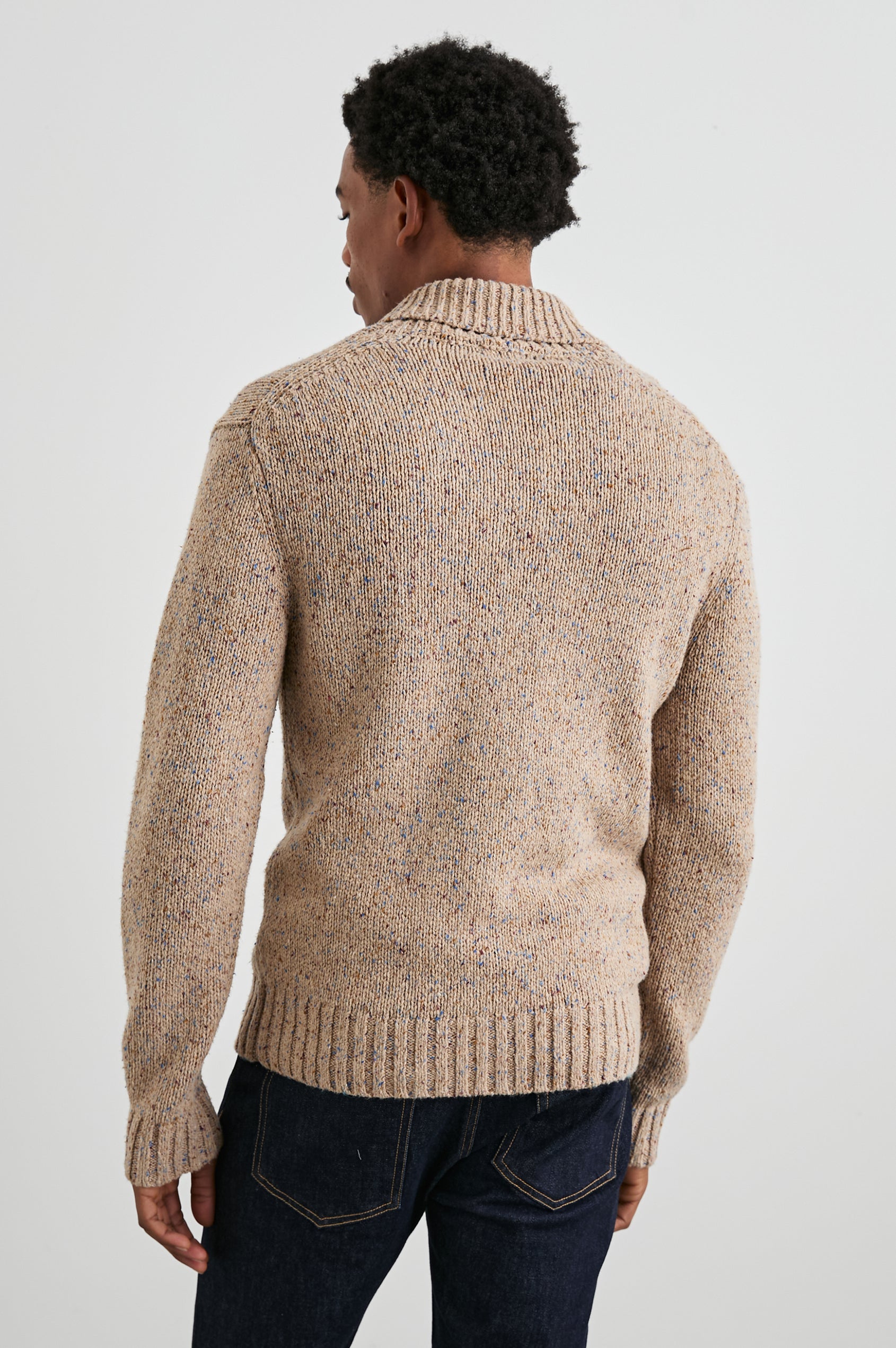 Corden Long-Sleeve Cardigan with Button Closure, a Shawl Collar and Ribbed Trim in Oatmeal Speckle Colorway - Back View Featured on Model