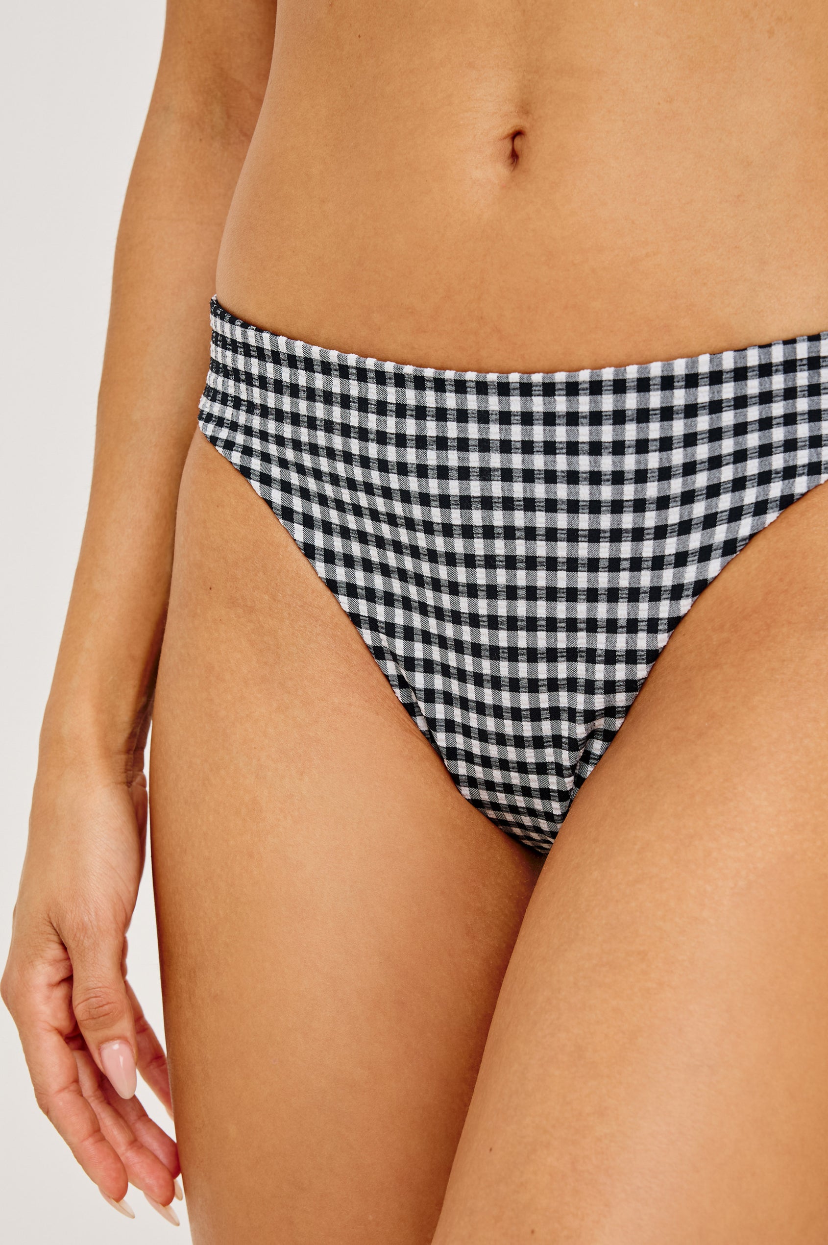 Corsica Bikini Bottom With Fixed Side Straps and Cheeky Rear Coverage in Black White Gingham Colorway - Lower Body Front Close Up View Featured on Model