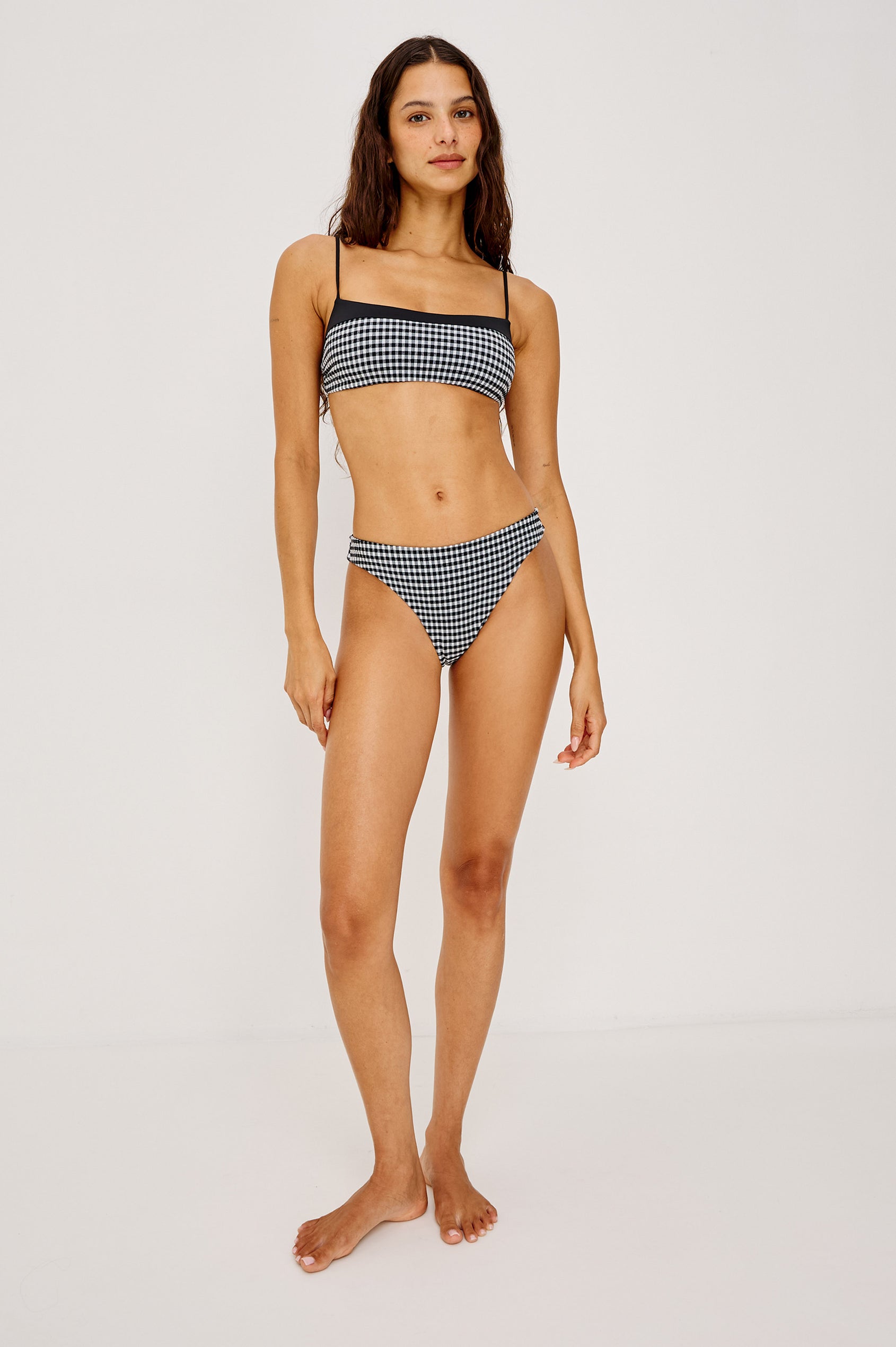 Corsica Bikini Bottom With Fixed Side Straps and Cheeky Rear Coverage in Black White Gingham Colorway - Full Body Front View Featured on Model