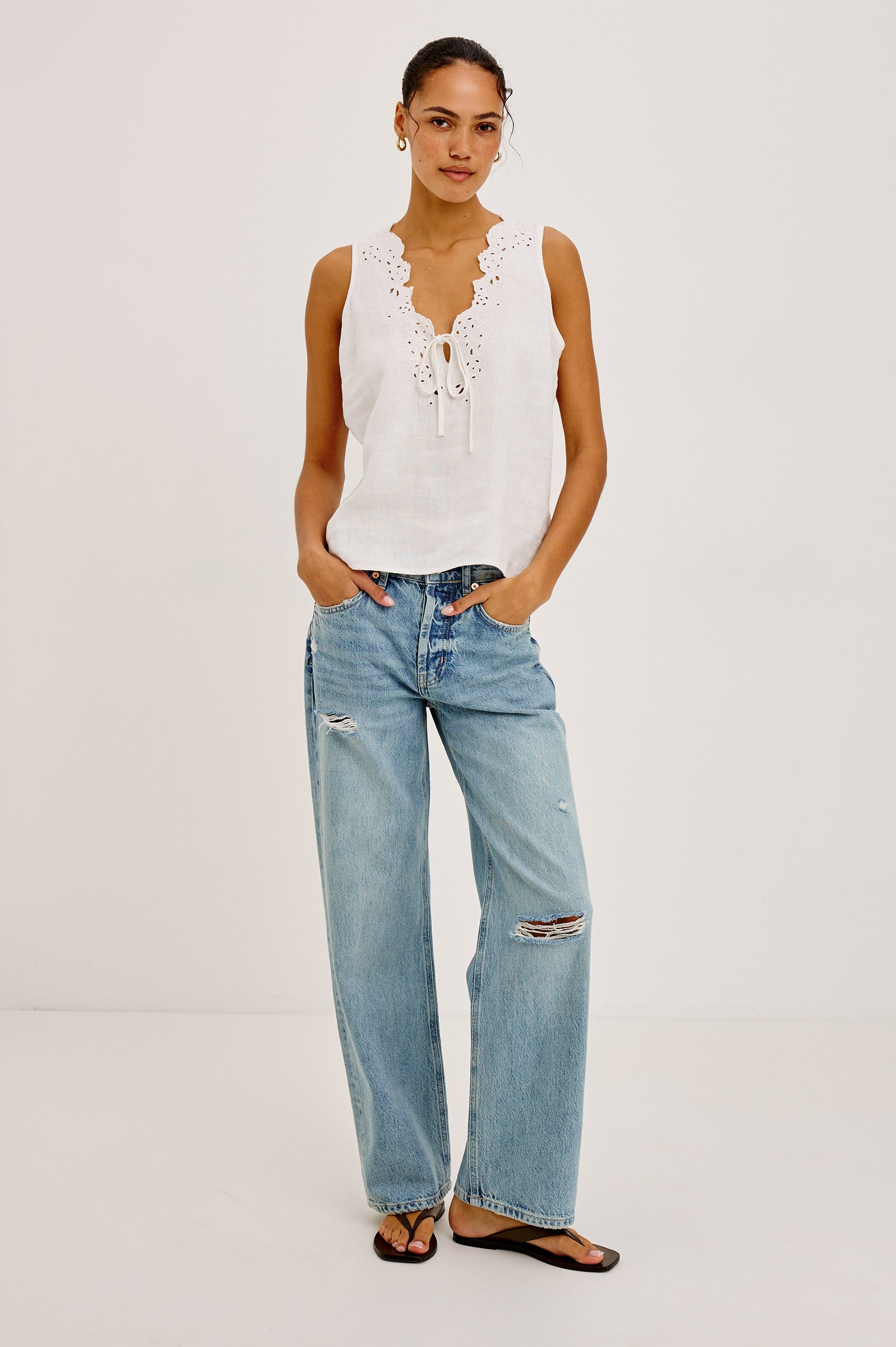 Cornelia Sleeveless Top in Heavy Linen With Embroidered Deep V-Neckline and Keyhole Self-Ties in White Colorway - Full Body Front View Featured on Model