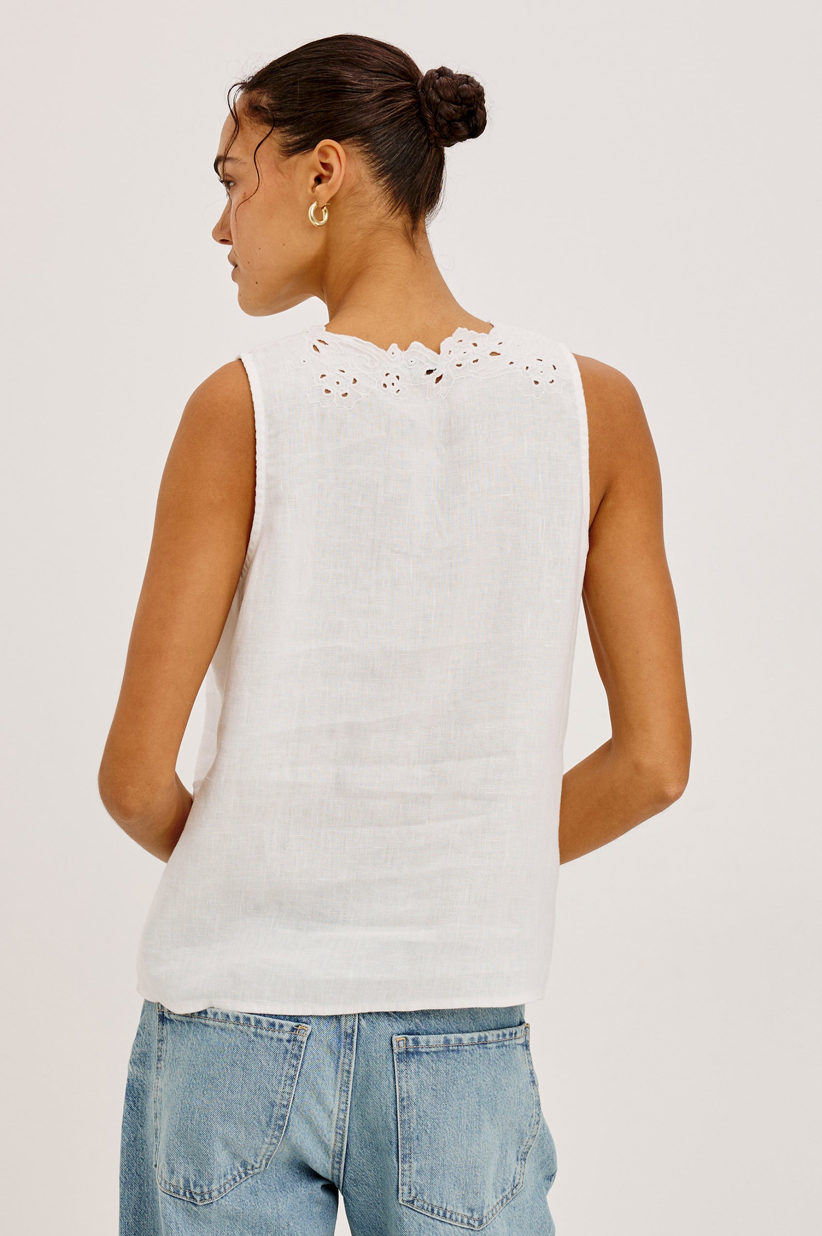Cornelia Sleeveless Top in Heavy Linen With Embroidered Deep V-Neckline and Keyhole Self-Ties in White Colorway - Upper Body Back View Featured on Model