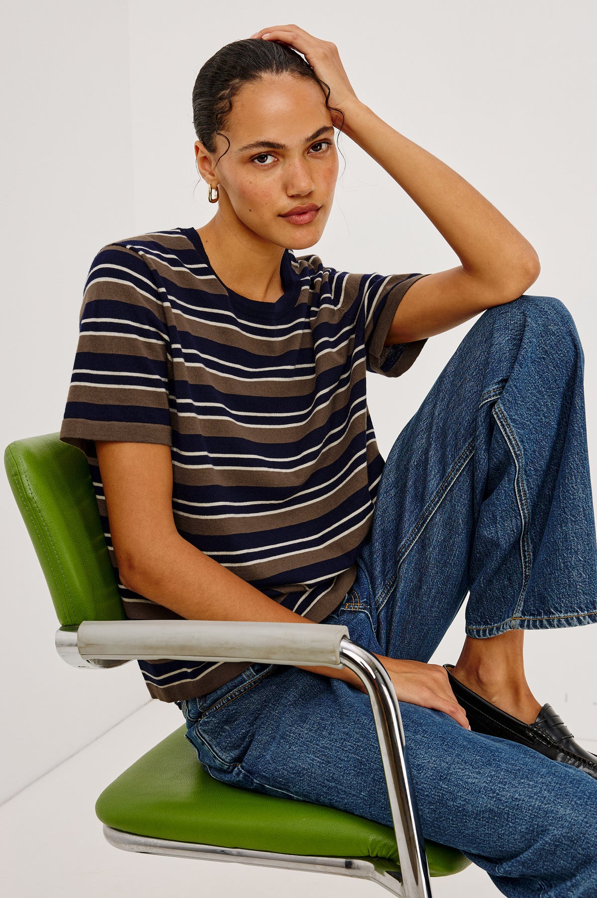 Cotton Cashmere Short Sleeve T-Shirt With Crew Neckline and Relaxed Fit in Navy Cedar Stripe Colorway - Upper Body View Featured on Model Sitting