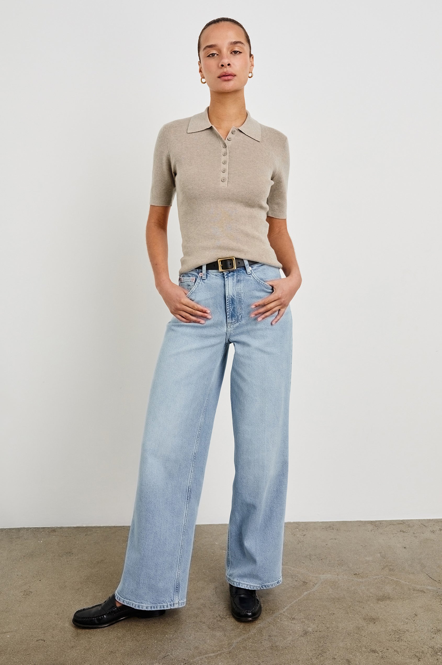 Court Polo Ribbed Knit Short Sleeve Top In Colorway Heather Oat - full body front view on model with belt