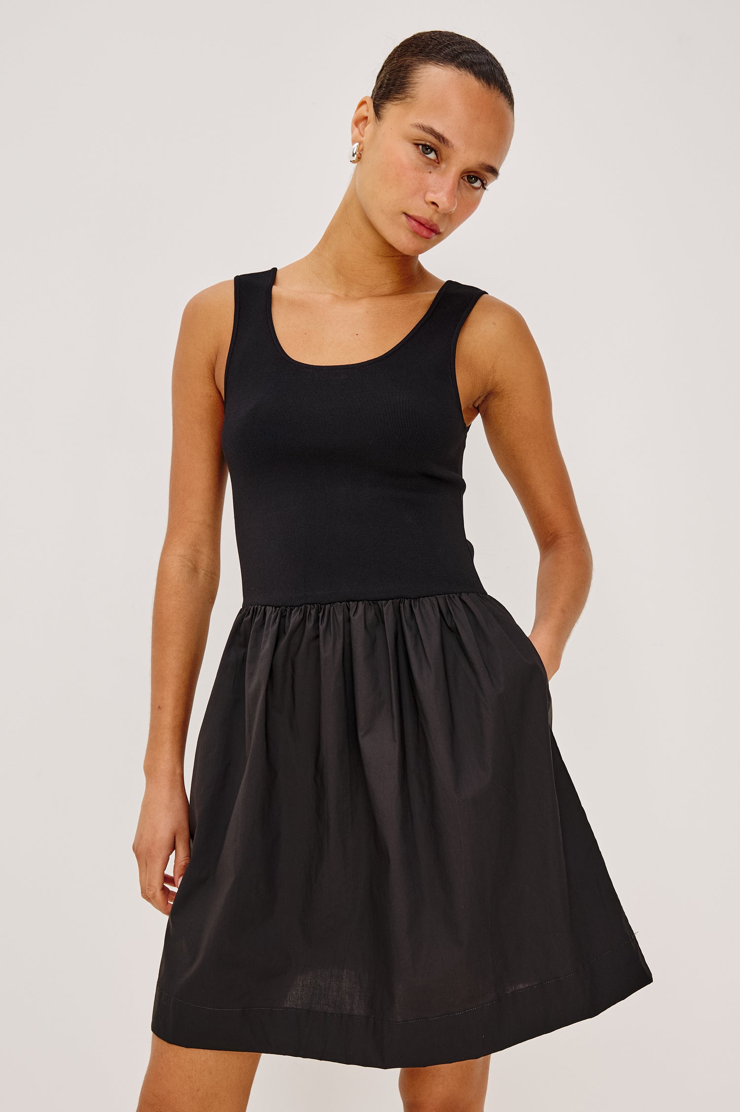 Courtney Mini Dress With Soft Jersey Bodice and Dropwaist Cotton Poplin Skirt, Tank Straps, Scoop Neckline, and Side Pockets in Black Colorway - Upper Body Front View Featured on Model