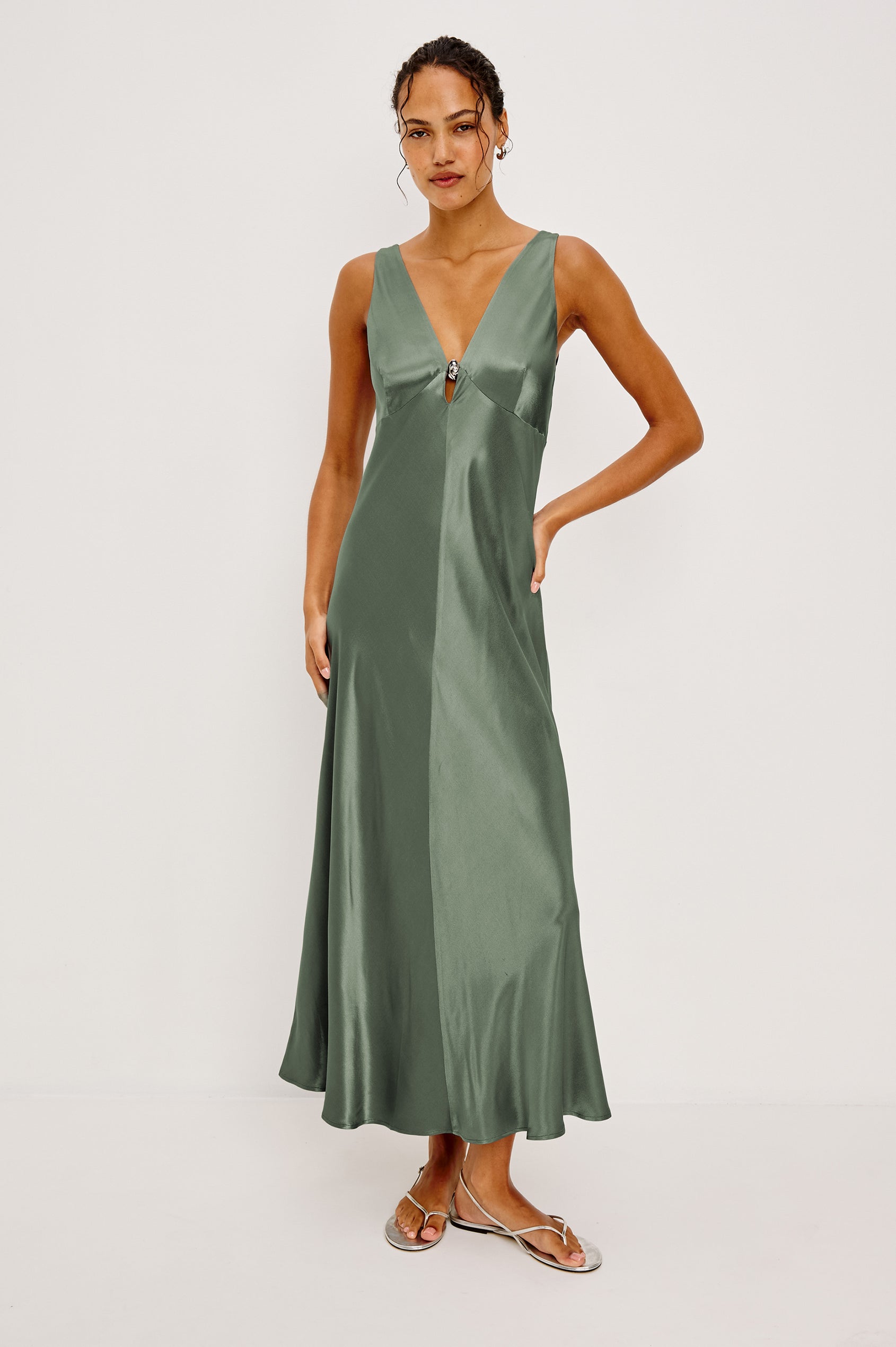 Cressia Midi Dress in Satin With Bias Cut and V-Neckline With Keyhole Cutout and Molded Metallic Jewelry in Ivy Colorway - Full Body Front View Featured on Model