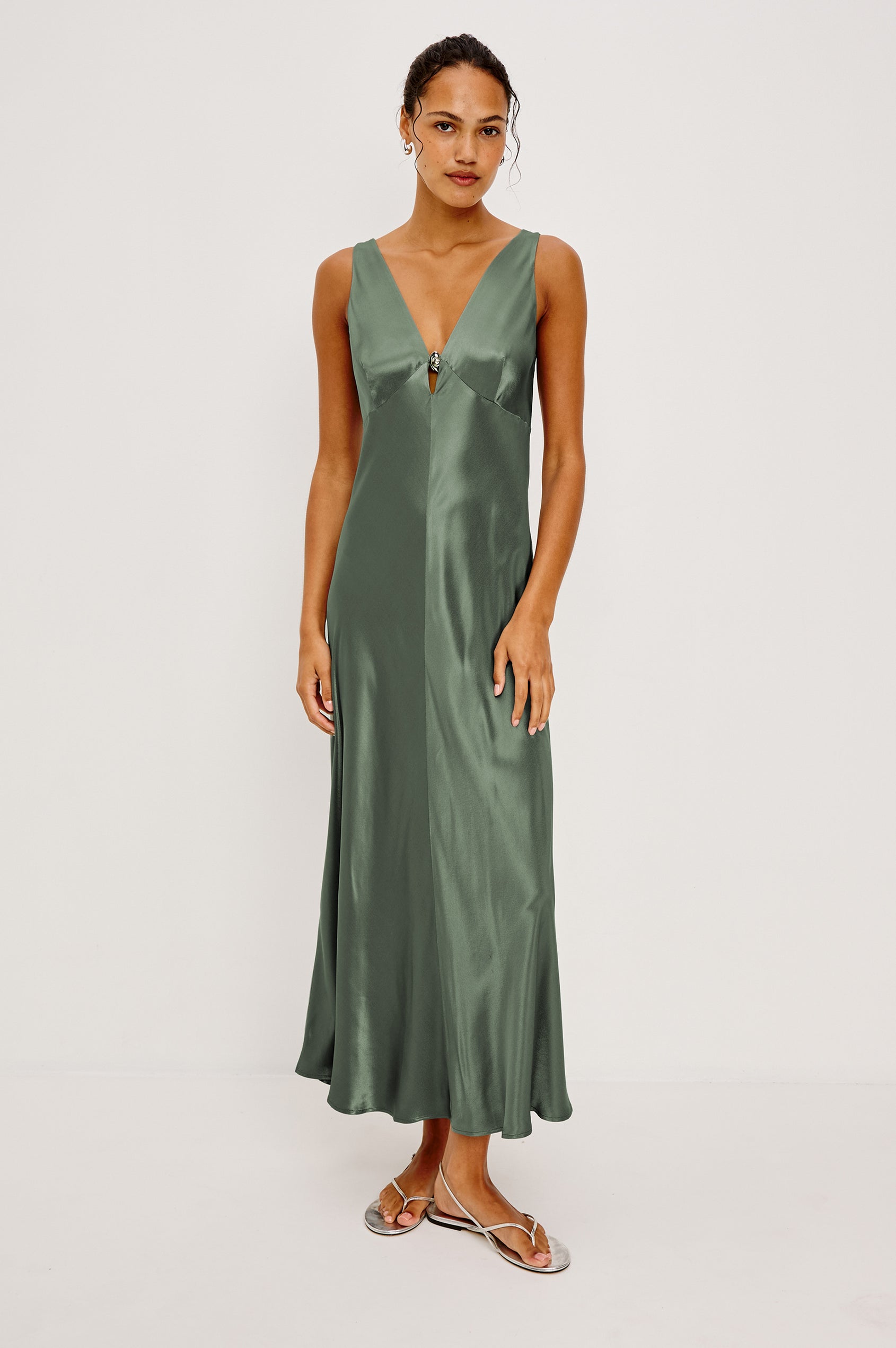 Cressia Midi Dress in Satin With Bias Cut and V-Neckline With Keyhole Cutout and Molded Metallic Jewelry in Ivy Colorway - Full Body Front View Featured on Model