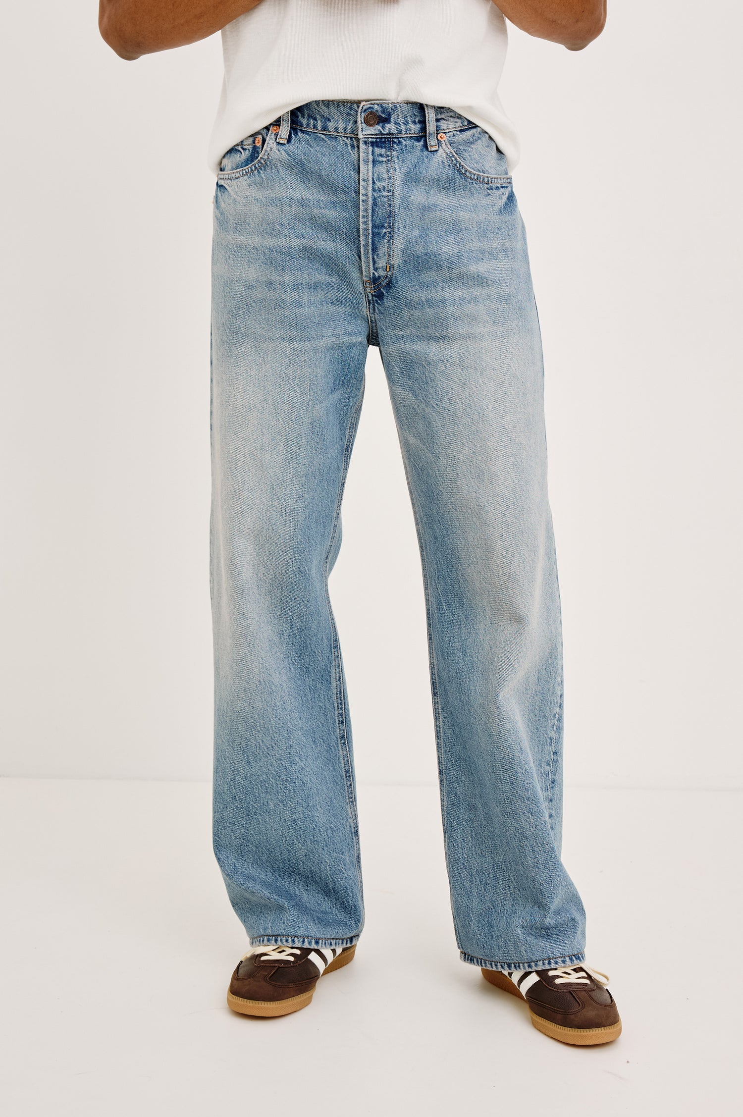 Cutler '90s Loose Jean in Rigid Denim With Loose Legs, Light Distressing, Front Zip Fly, and 5-Pockets in Medium Vintage Wash Colorway - Lower Body Front View Featured on Model
