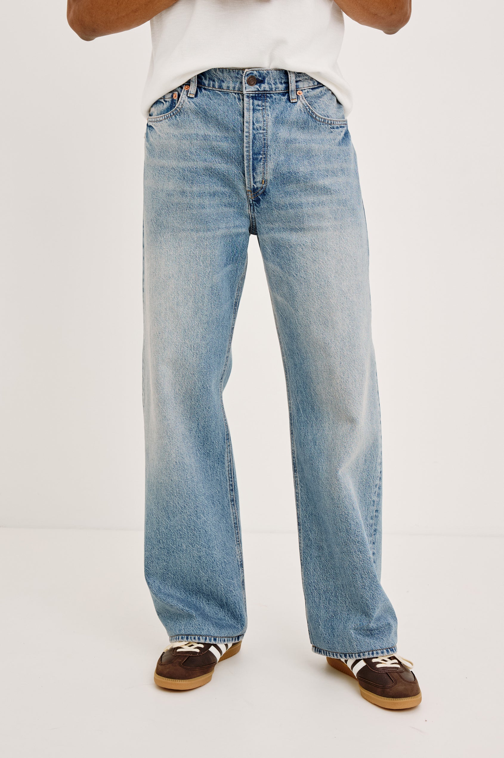 Cutler '90s Loose Jean in Rigid Denim With Loose Legs, Light Distressing, Front Zip Fly, and 5-Pockets in Medium Vintage Wash Colorway - Lower Body Front View Featured on Model