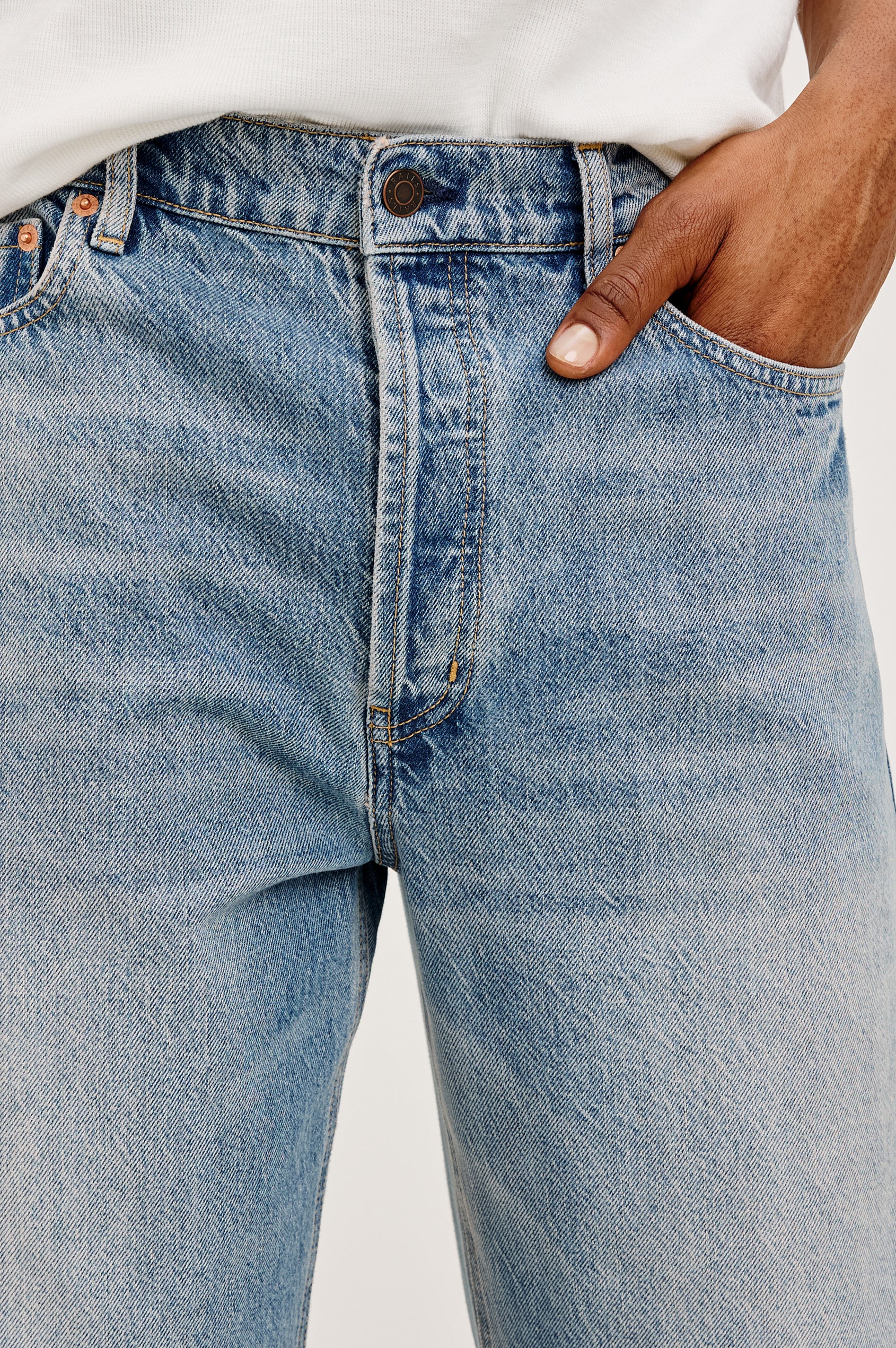 Cutler '90s Loose Jean in Rigid Denim With Loose Legs, Light Distressing, Front Zip Fly, and 5-Pockets in Medium Vintage Wash Colorway - Lower Body Close Up View Featured on Model