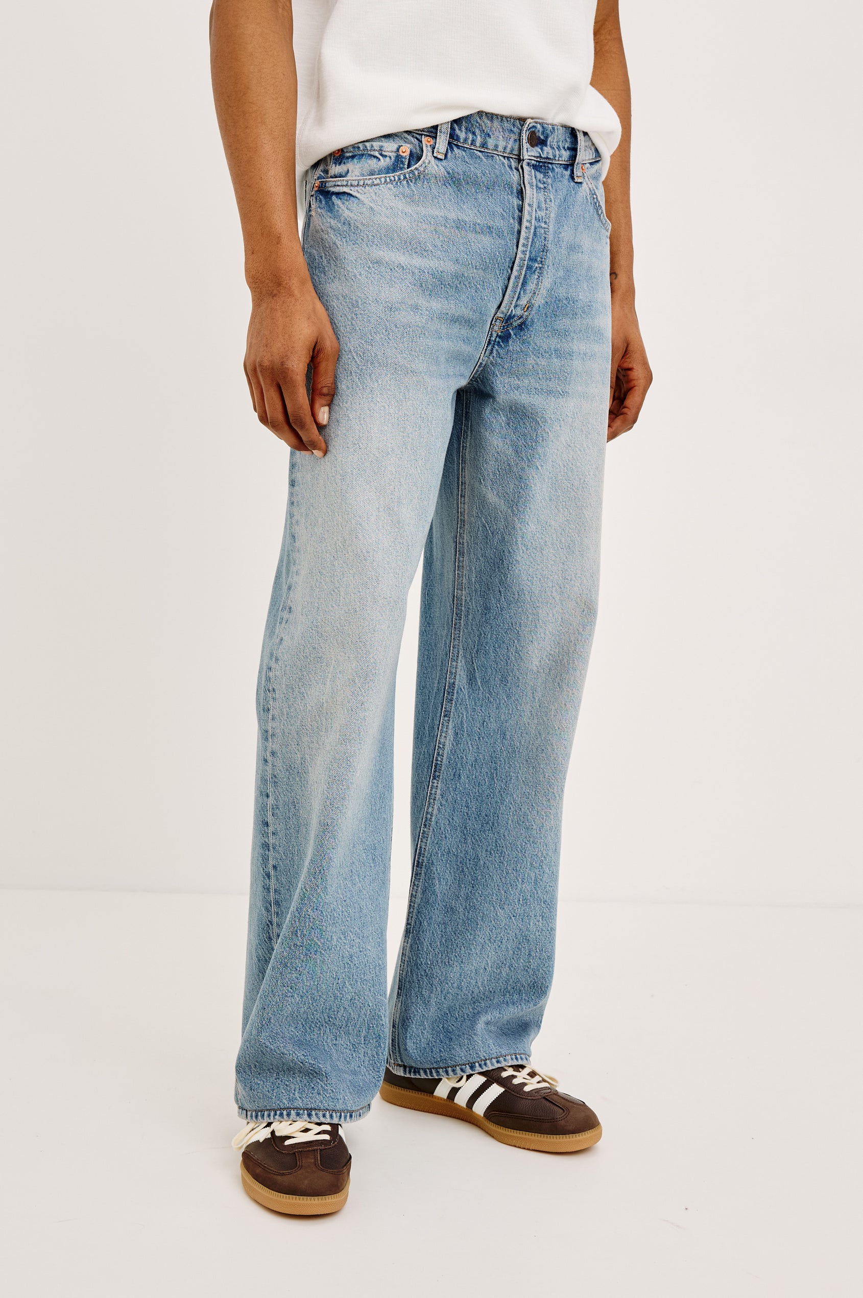 Cutler '90s Loose Jean in Rigid Denim With Loose Legs, Light Distressing, Front Zip Fly, and 5-Pockets in Medium Vintage Wash Colorway - Full Body Front View Featured on Model
