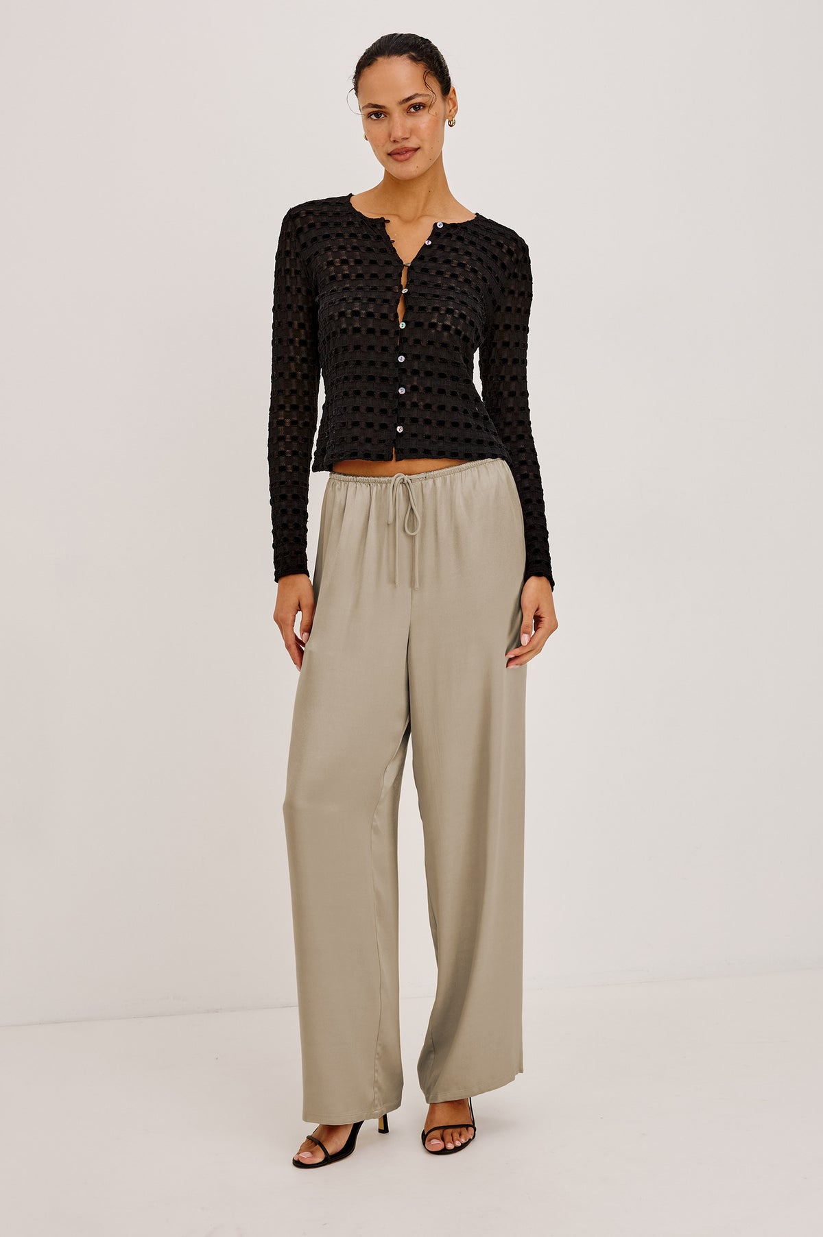 Cyrah Cardigan in Sheer Stretch Lace With Fitted Long Sleeves, and Front Button-and-Loop Closures in Black Checkerboard ColorwayFull Body Front View Featured on Model.