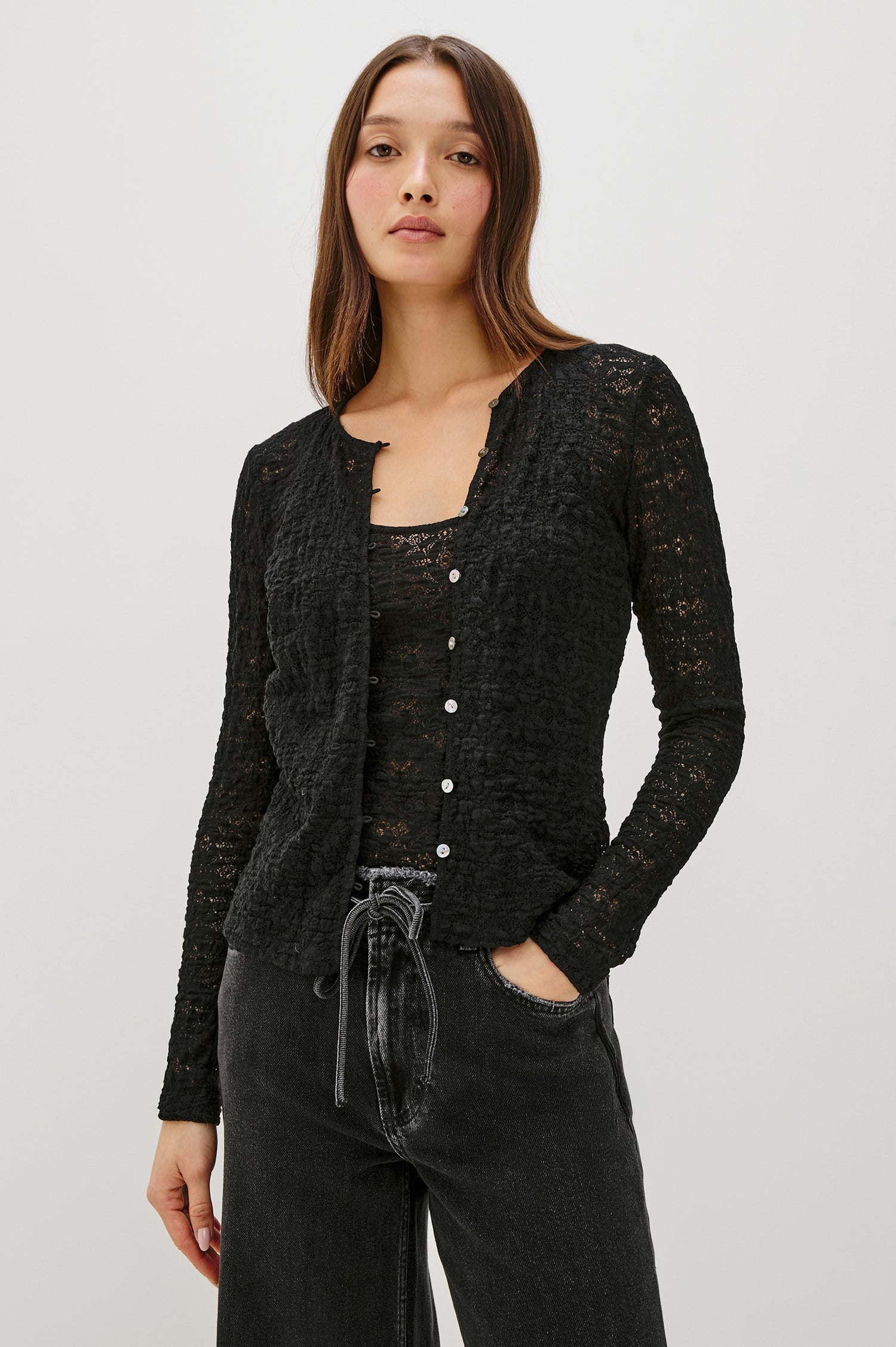 Cyrah long-sleeve top in Black Lace with a button-front closure - front view featured on model.