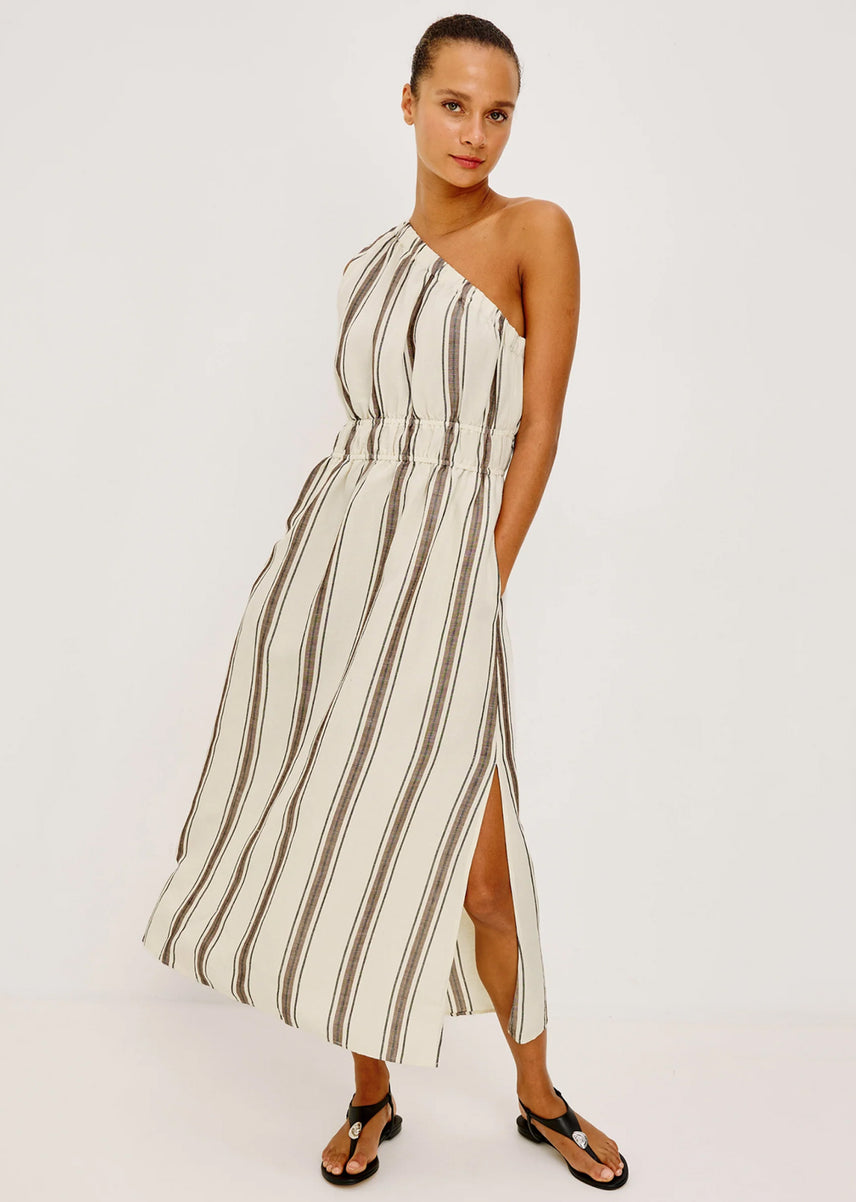 Woman wearing a one shoulder midi dress with brown stripes 