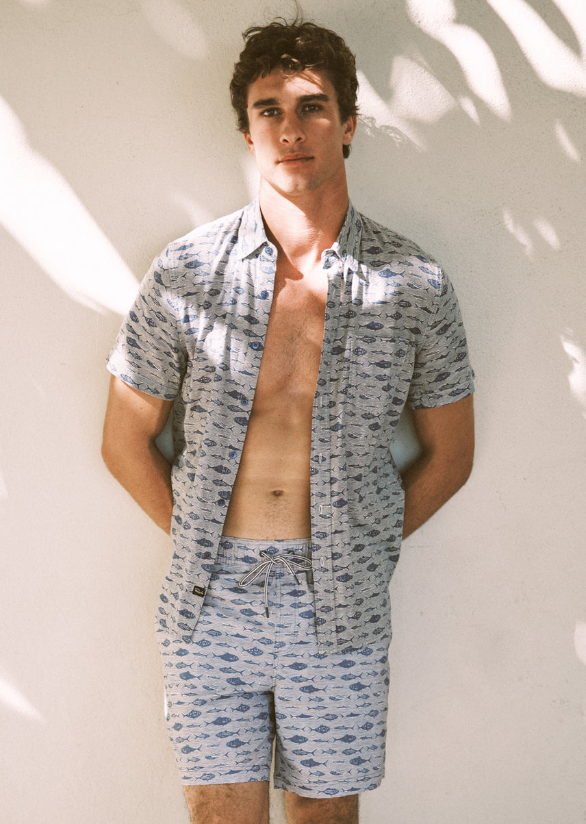 Man wearing a matching set with fish all over