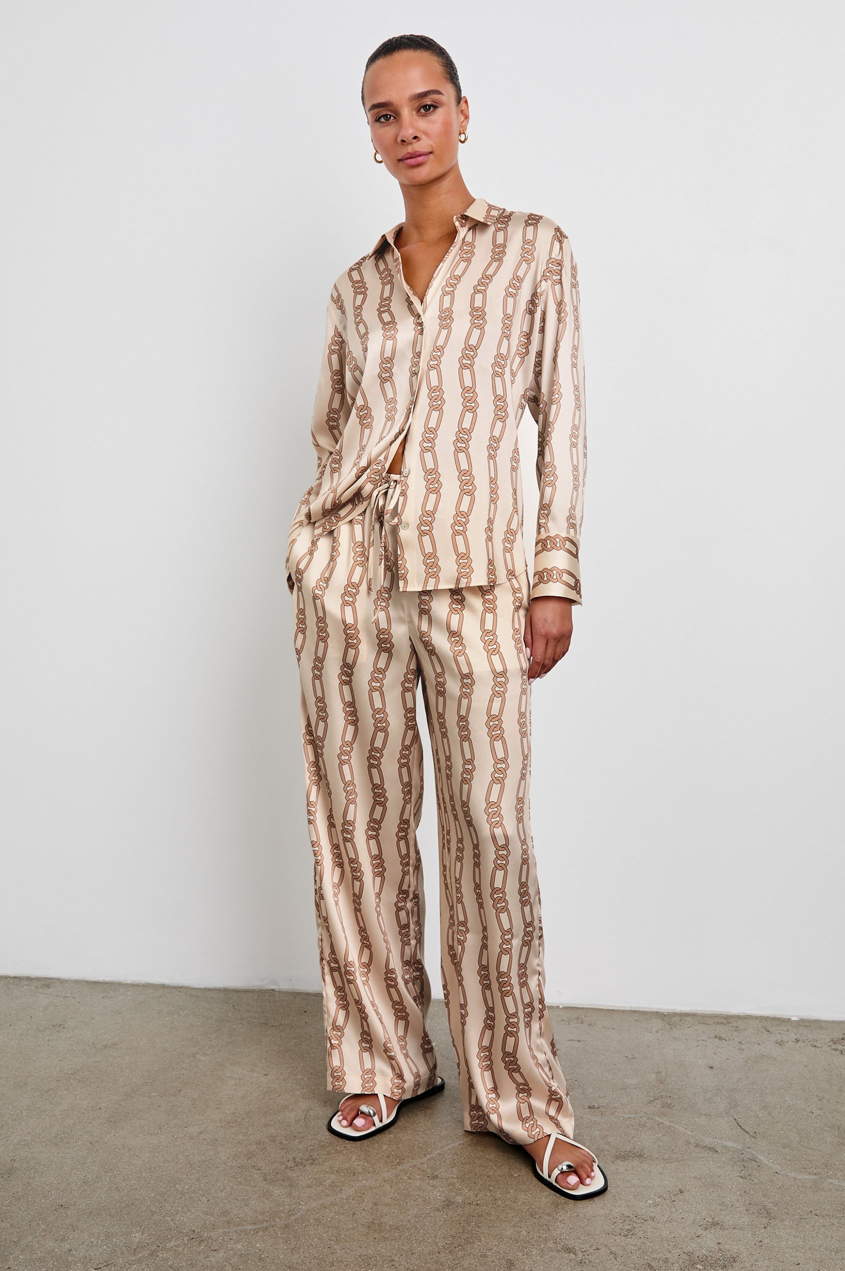 Damini Pants with a Drawstring Waist and Two Front Pockets in Ivory Gold Link Colorway, with Vertical rows of gold links on ivory - Front Full Body View Featured on Model