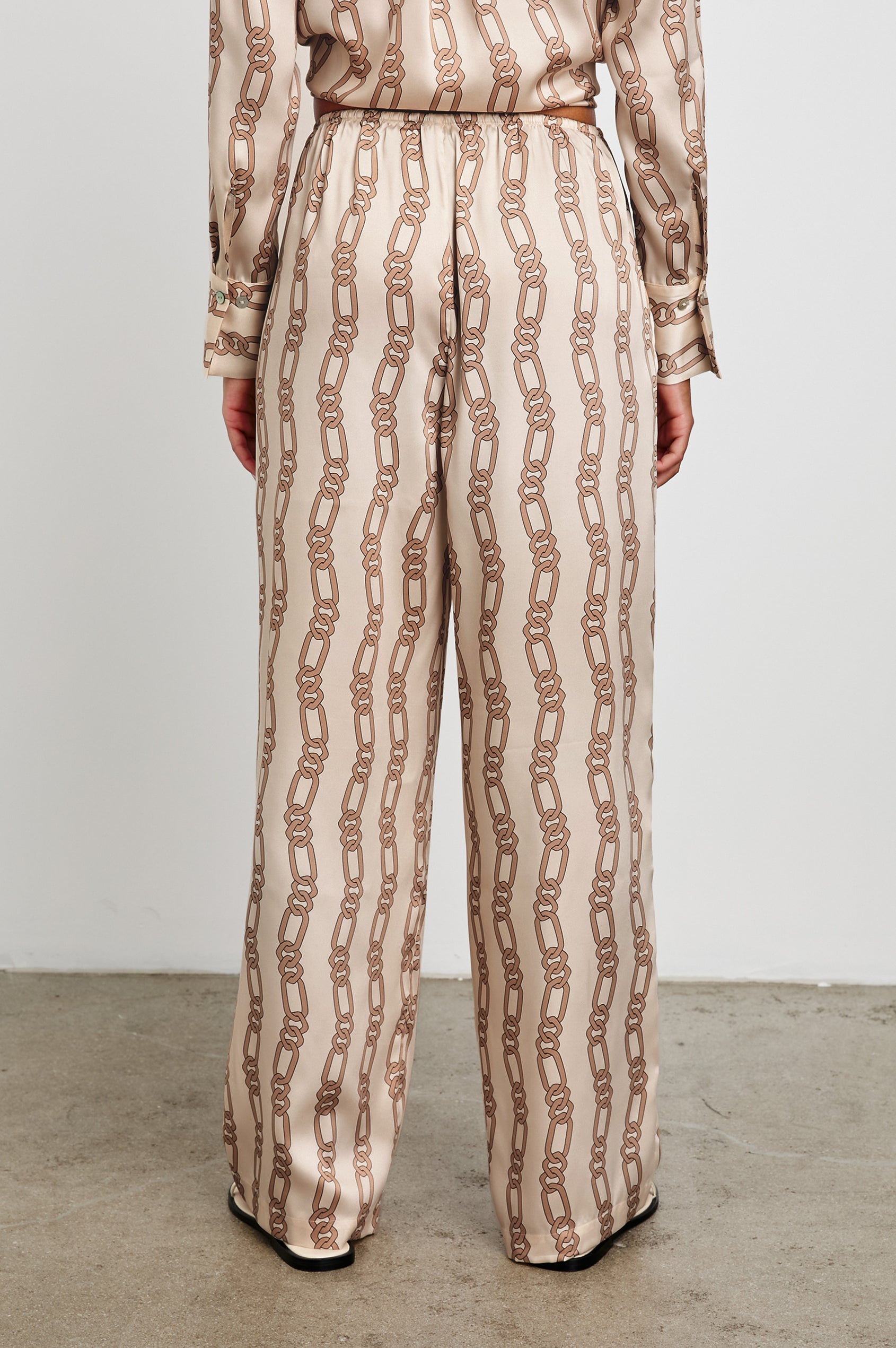 Damini Pants with a Drawstring Waist and Two Front Pockets in Ivory Gold Link Colorway, with Vertical rows of gold links on ivory - Back View Featured on Model