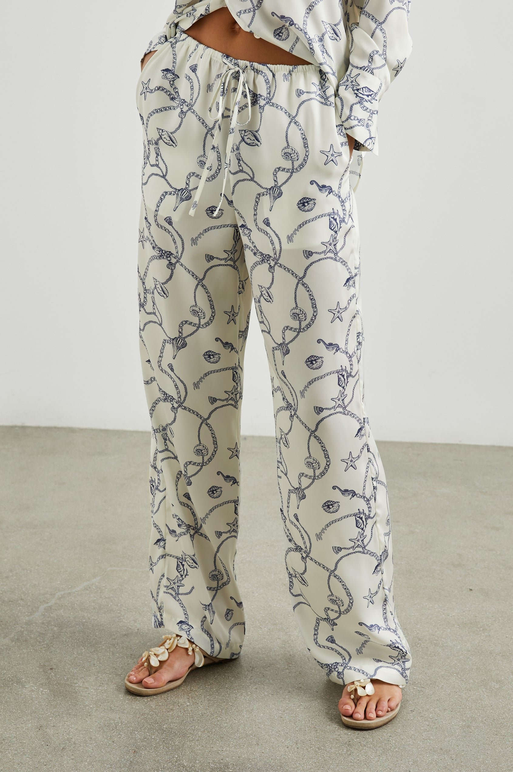 Damini Pants with a Drawstring Waist and Two Front Pockets in Nautical Chain Colorway, with a blue Nautical pattern on white - Front View Featured on Model