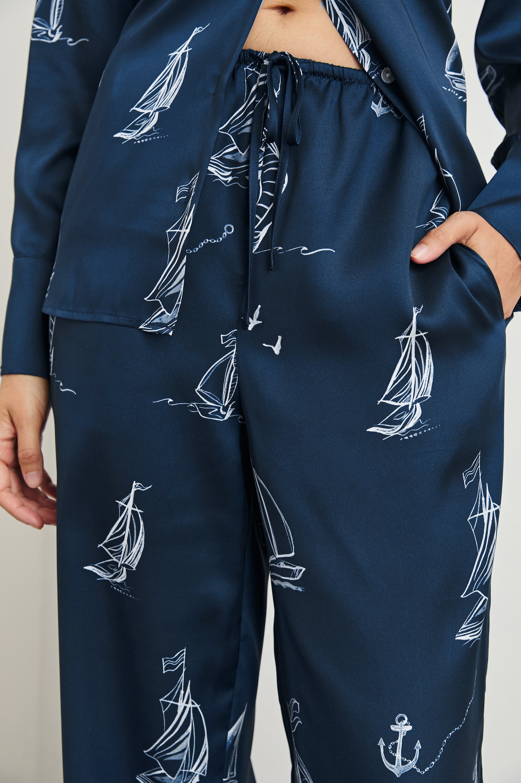 Damani Pants with a Drawstring Waist and Two Front Pockets in Sailboats Colorway, white sailboats on dark blue - Front View Featured on Model