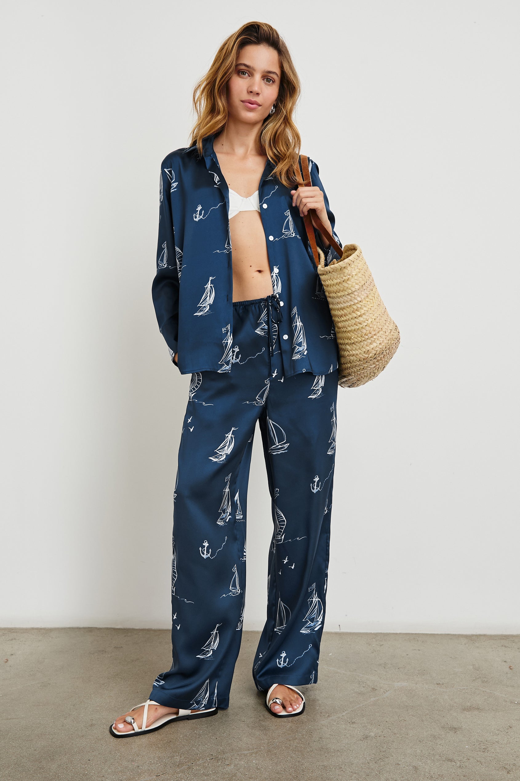 Damani Pants with a Drawstring Waist and Two Front Pockets in Sailboats Colorway, white sailboats on dark blue - Front Full Body View Featured on Model