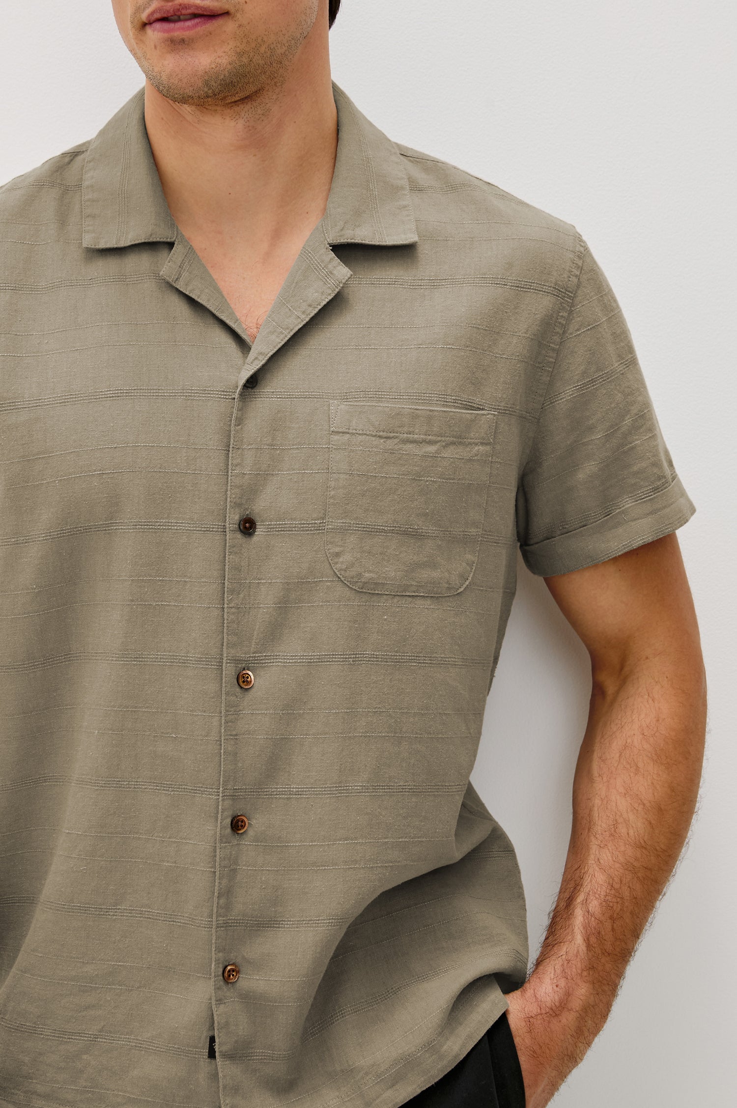 Davis Short Sleeve Button Up with a Chest Patch Pocket, Rolled Cuffs and Textured Horizontal Stripes in Crater Colorway - Front Detail View Featured on Model