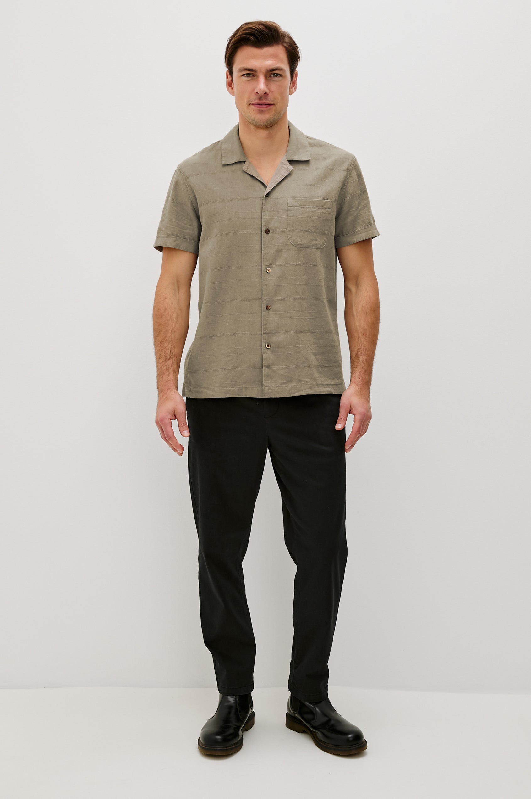 Davis Short Sleeve Button Up with a Chest Patch Pocket, Rolled Cuffs and Textured Horizontal Stripes in Crater Colorway - Full Body Front View Featured on Model