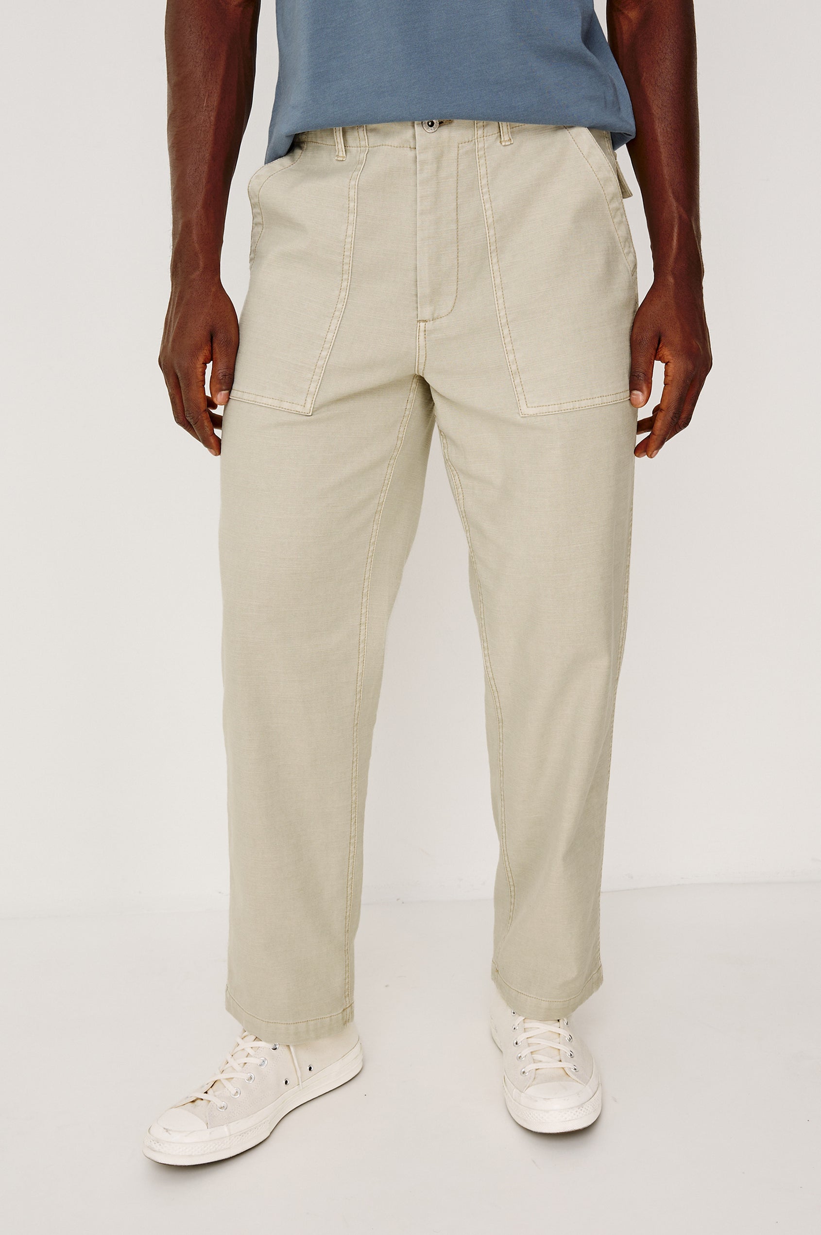 Decker Relaxed Straight Leg Workwear Pant in Stretch Cotton With Lived-In Wash, Zip Fly, and Side and Back Buttoned-Flap Pockets in Natural Colorway - Lower Body Front View Featured on Model
