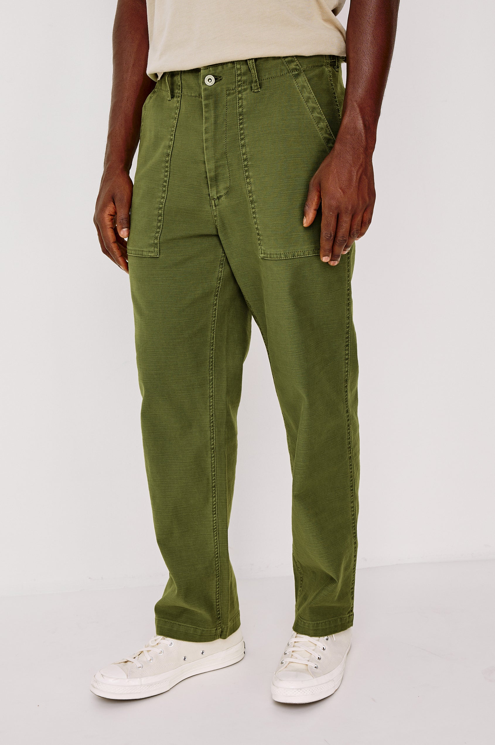 Decker Relaxed Straight Leg Workwear Pant in Stretch Cotton With Lived-In Wash, Zip Fly, and Side and Back Buttoned-Flap Pockets in Olive Colorway - Lower Body Close Up Front View Featured on Model