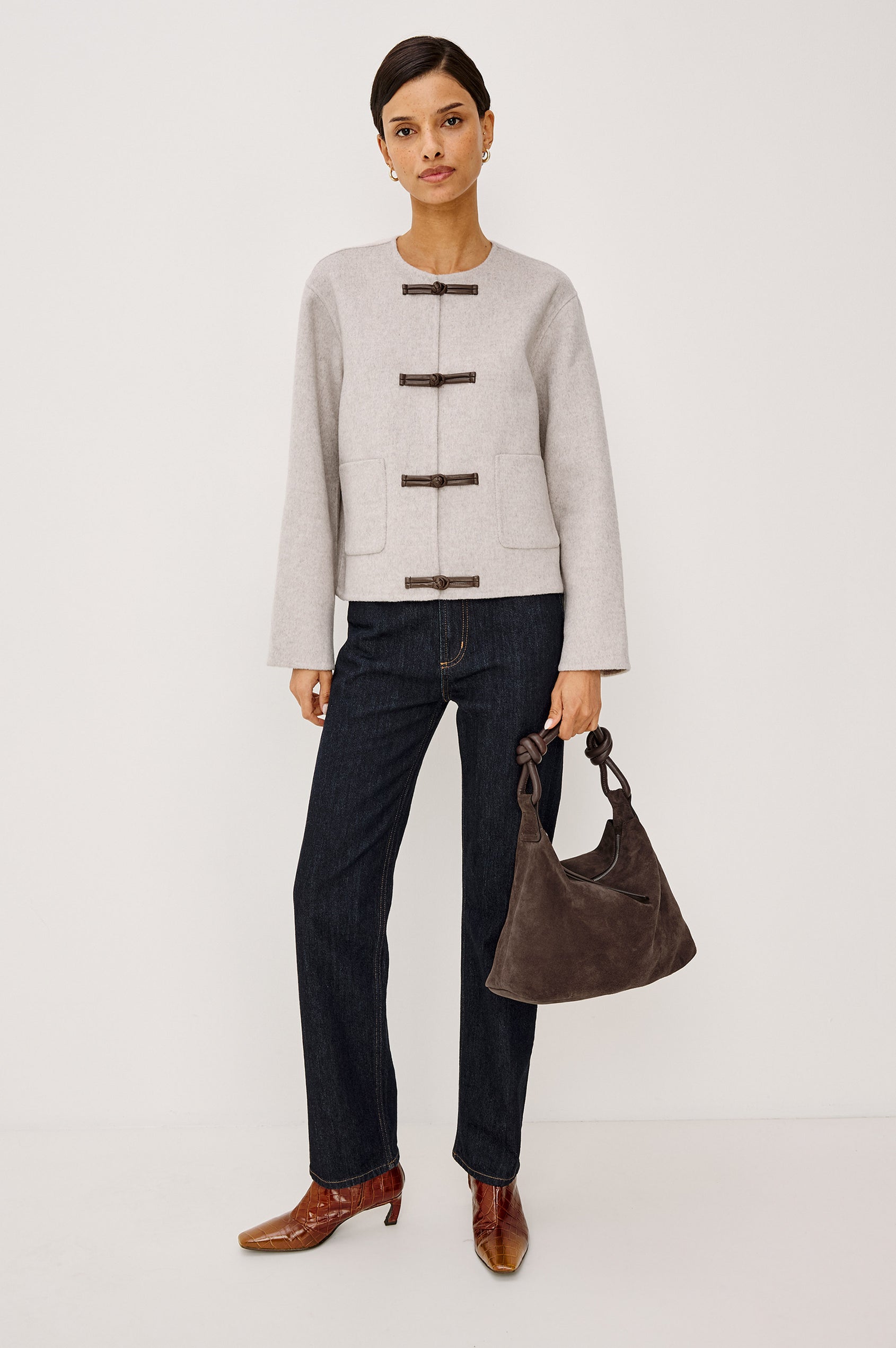 Deidre Jacket in Soft Wool Blend With Collarless Neckline, Boxy Cropped Fit, Front Leather Toggle Closures, Patch Pockets, and Long Sleeves in Heather Oat Colorway - Full Body Front View Featured on Model
