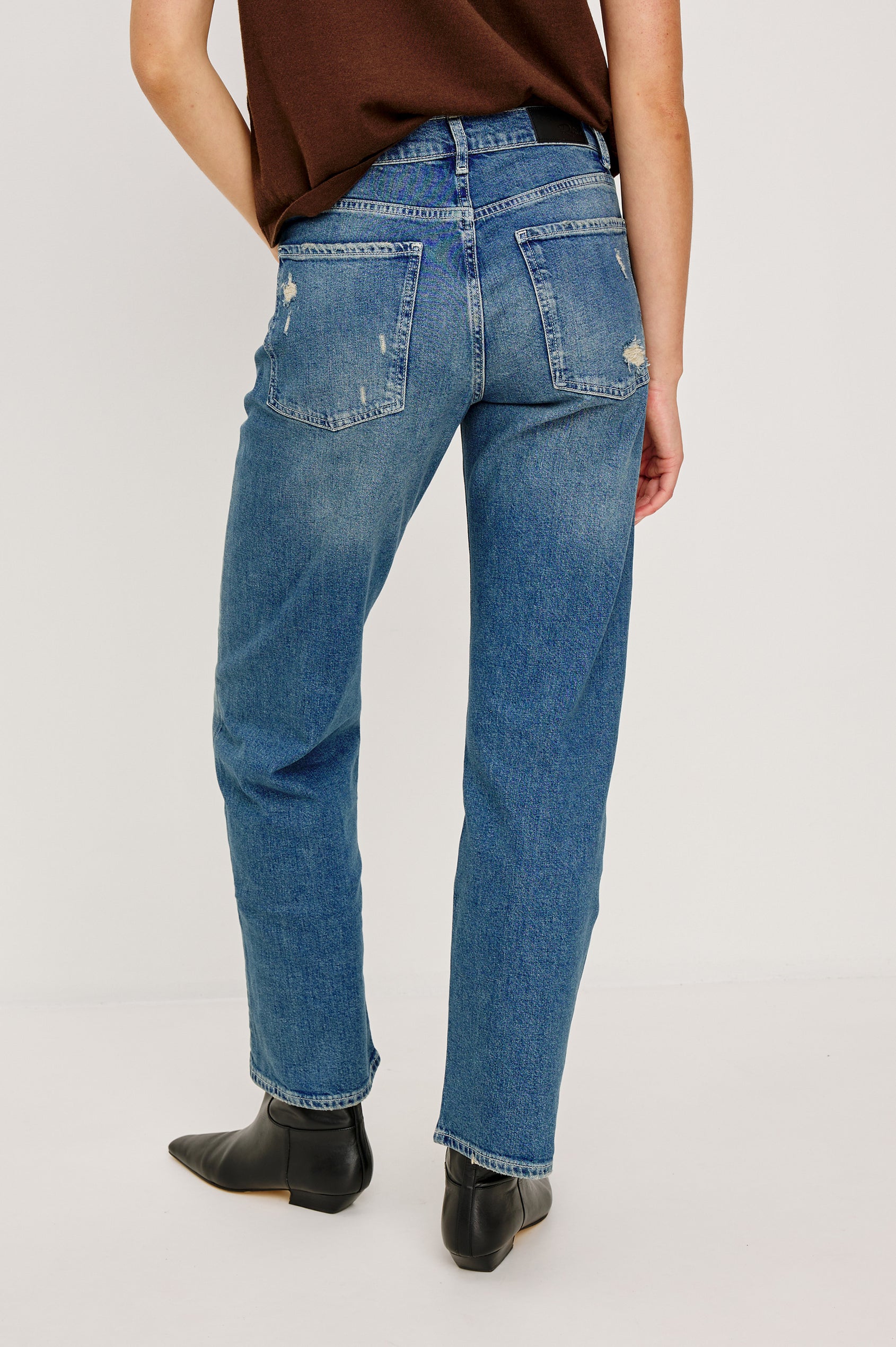 Del Mar low slung baggy boyfriend 5-pocket jean in medium wash Tinted Indigo Destroy, with light destruction near front pockets - back view featured on model.