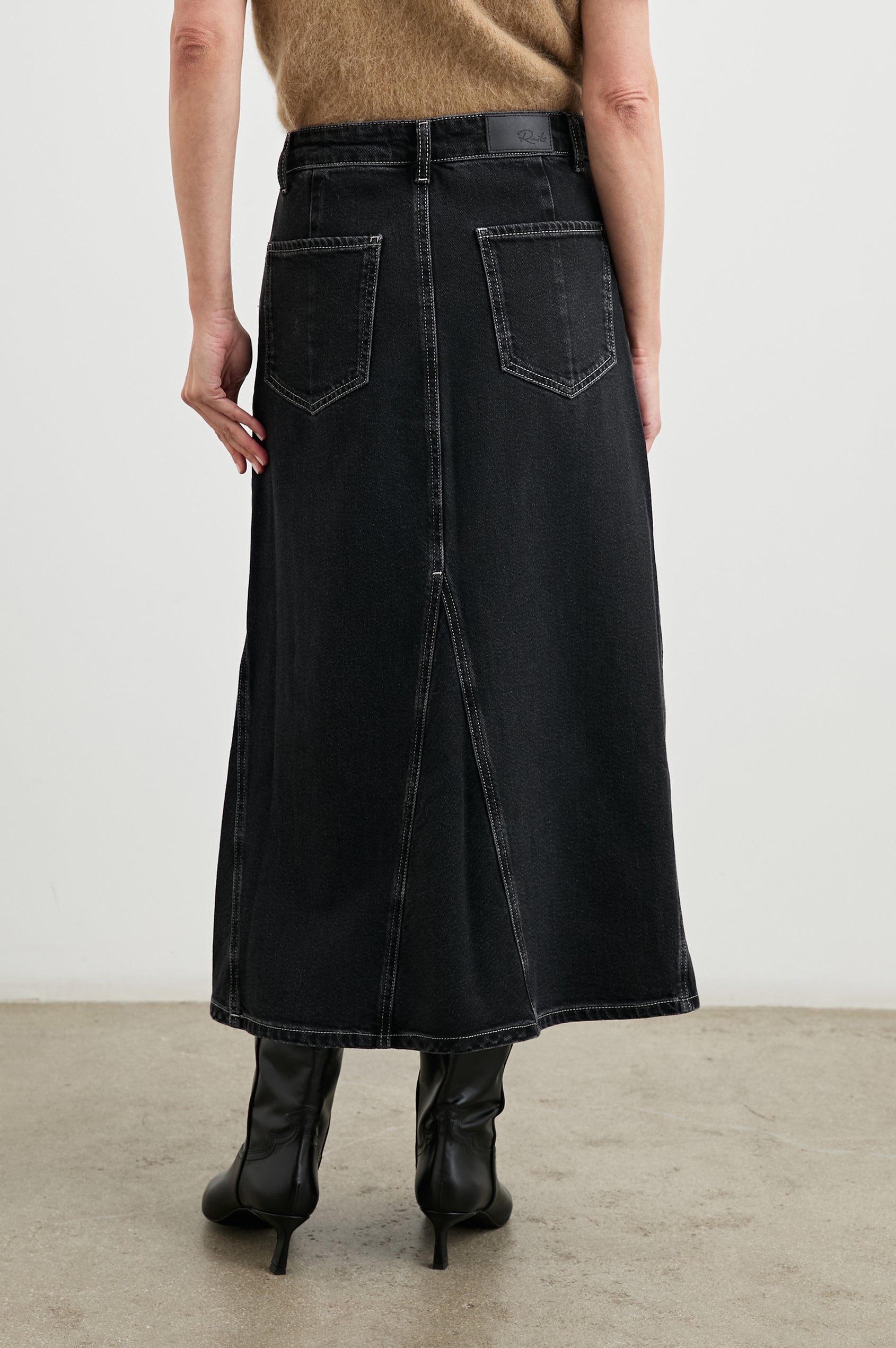 Del Rey Denim Midi Skirt with Western-Style Seams, Belt Loops, Two Front Pockets and Two Back Patch Pockets in Black Sand Colorway - Front View Featured on Model