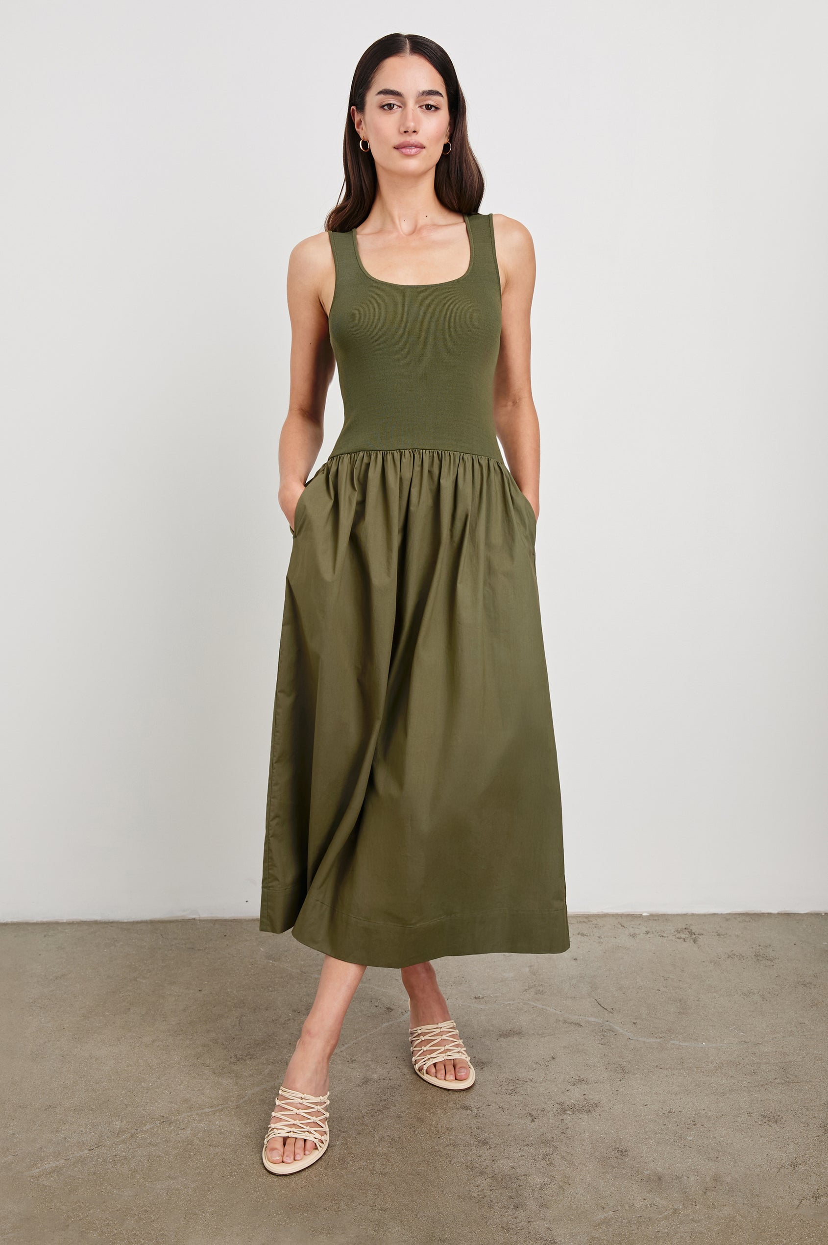 Dia tank midi dress with scoop neck and fitted bodice in Olive colorway - full body front view on model
