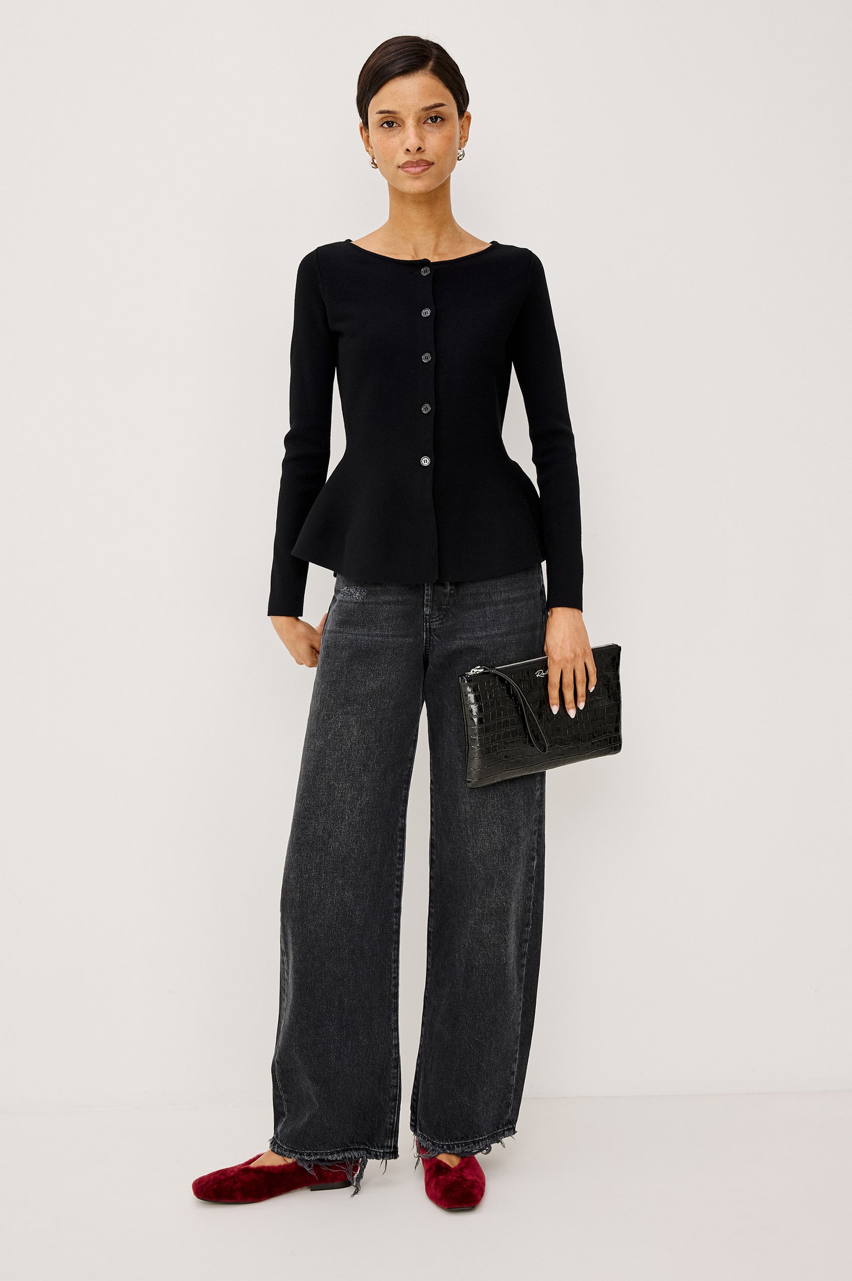 Diane Cardigan in Fine-Gauge Knit With Fitted Body, Peplum Hem, Round Neckline, and Center Front Placket With Self-Covered Buttons in Black Colorway - Full Body Front View Featured on Model