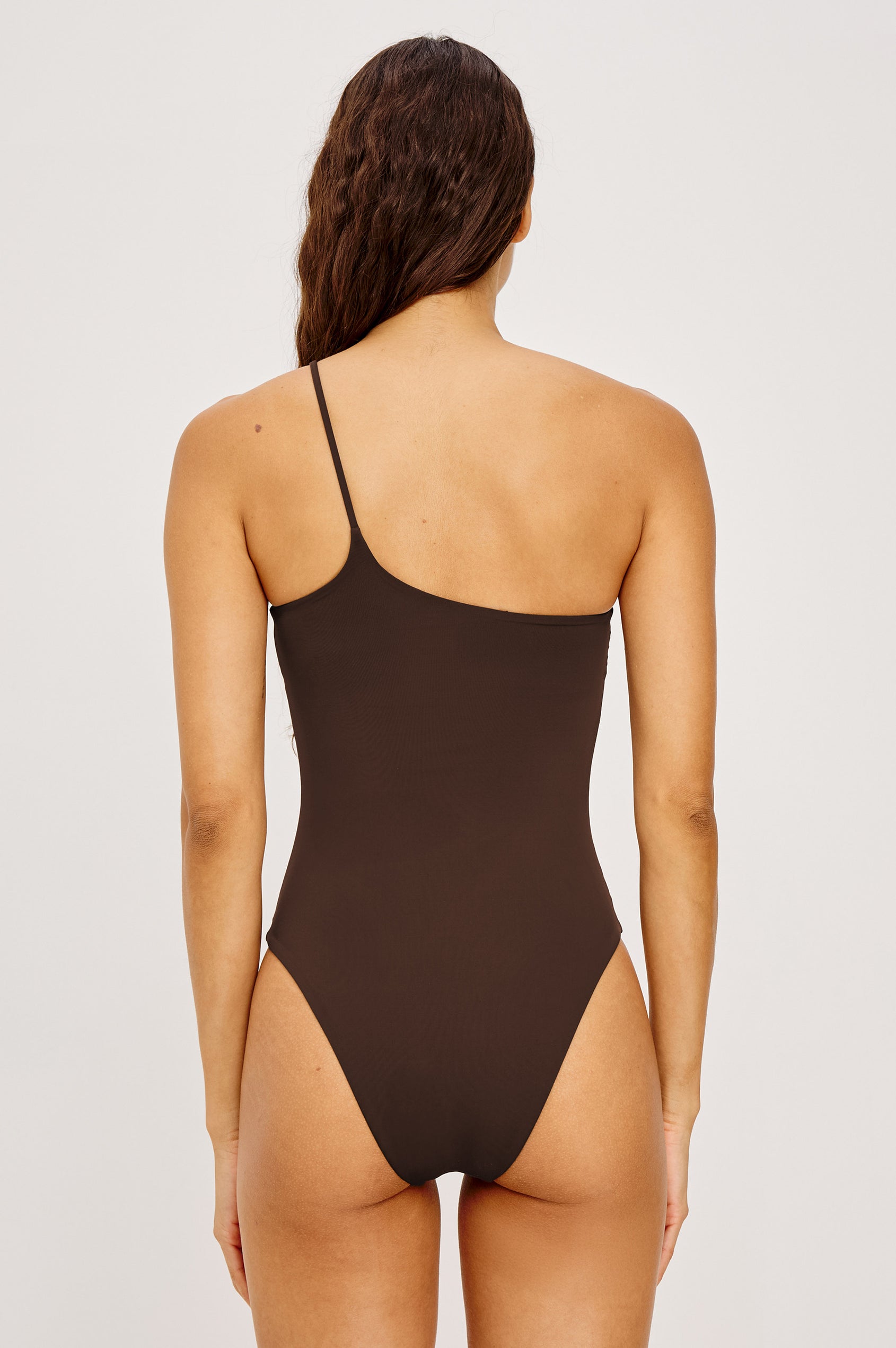 Diani One Piece Swimsuit With One-Shoulder Beaded Strap, High-Cut Legs, and Cheeky Rear Coverage in Espresso Colorway - Full Body Front View Featured on Model