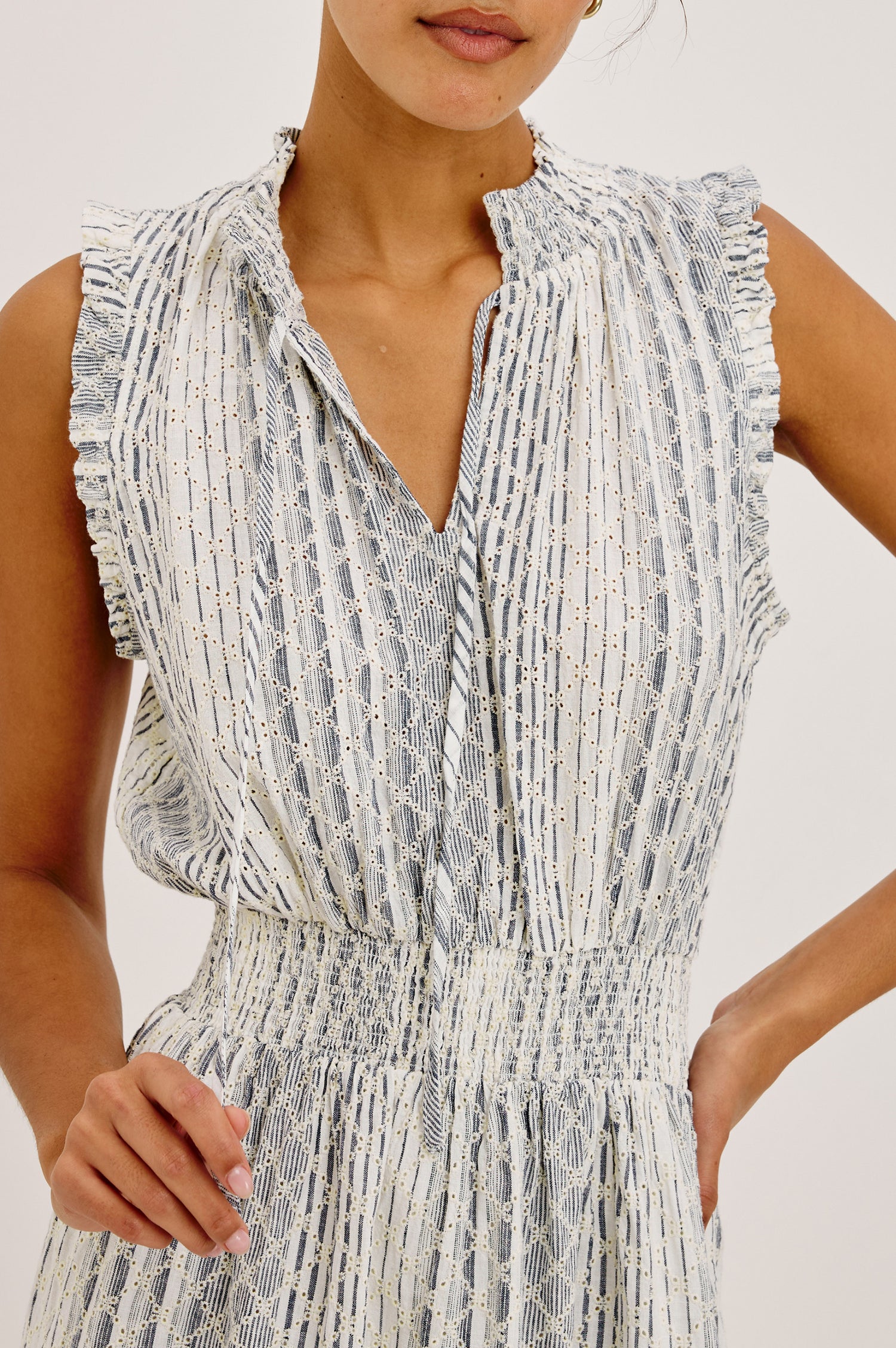 Didi Peasant Style Mini Dress in Luxe Linen With Front Button Placket, Smocked Waist, and Tiered Hem in Striped Eyelet Colorway - Upper Body Front View Featured on Model